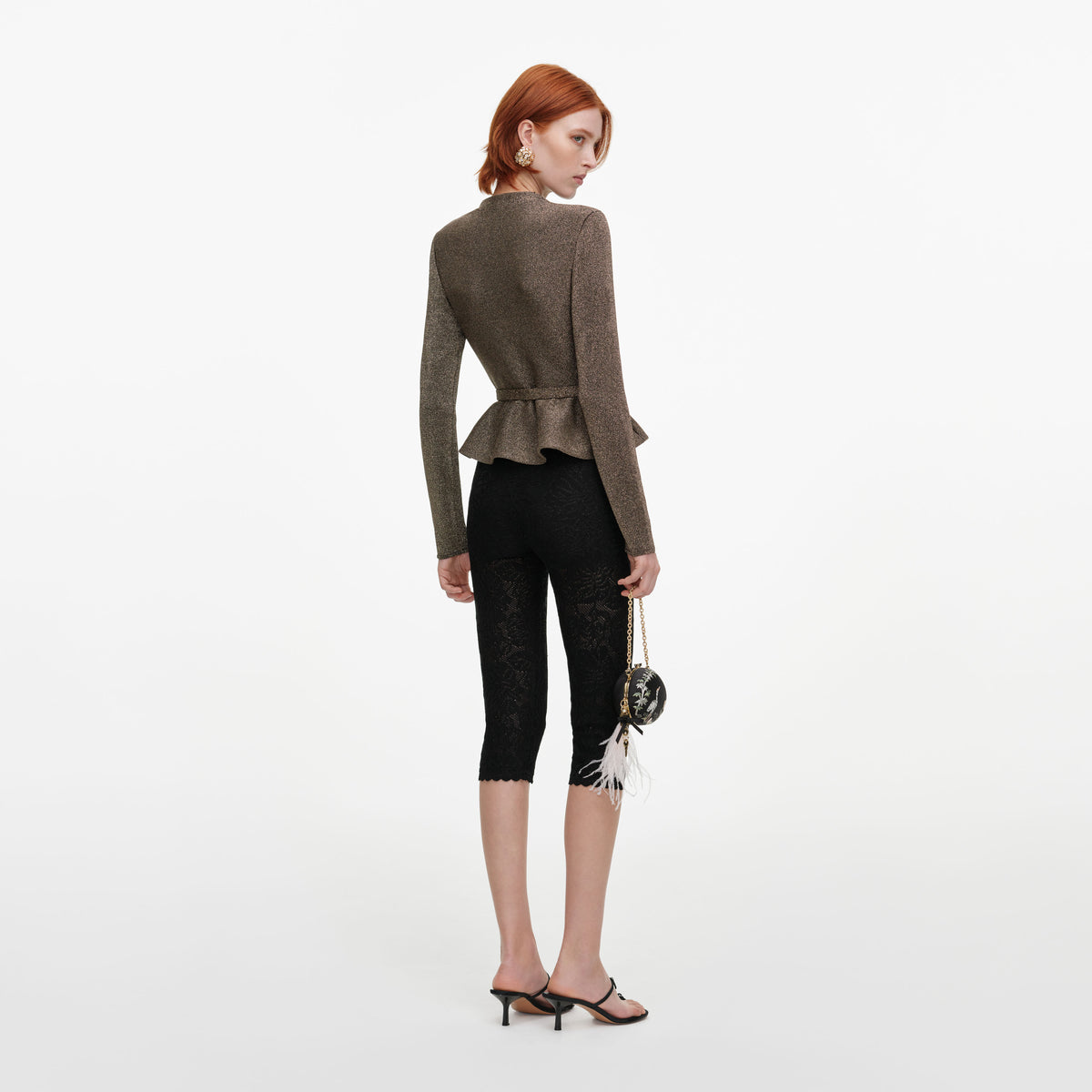 Back view of a woman wearing the Bronze Tailored Knit Top