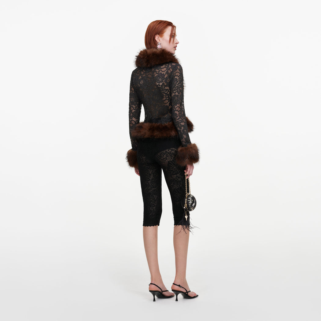 Back view of a woman wearing the Grey Lace Fur Collar Top