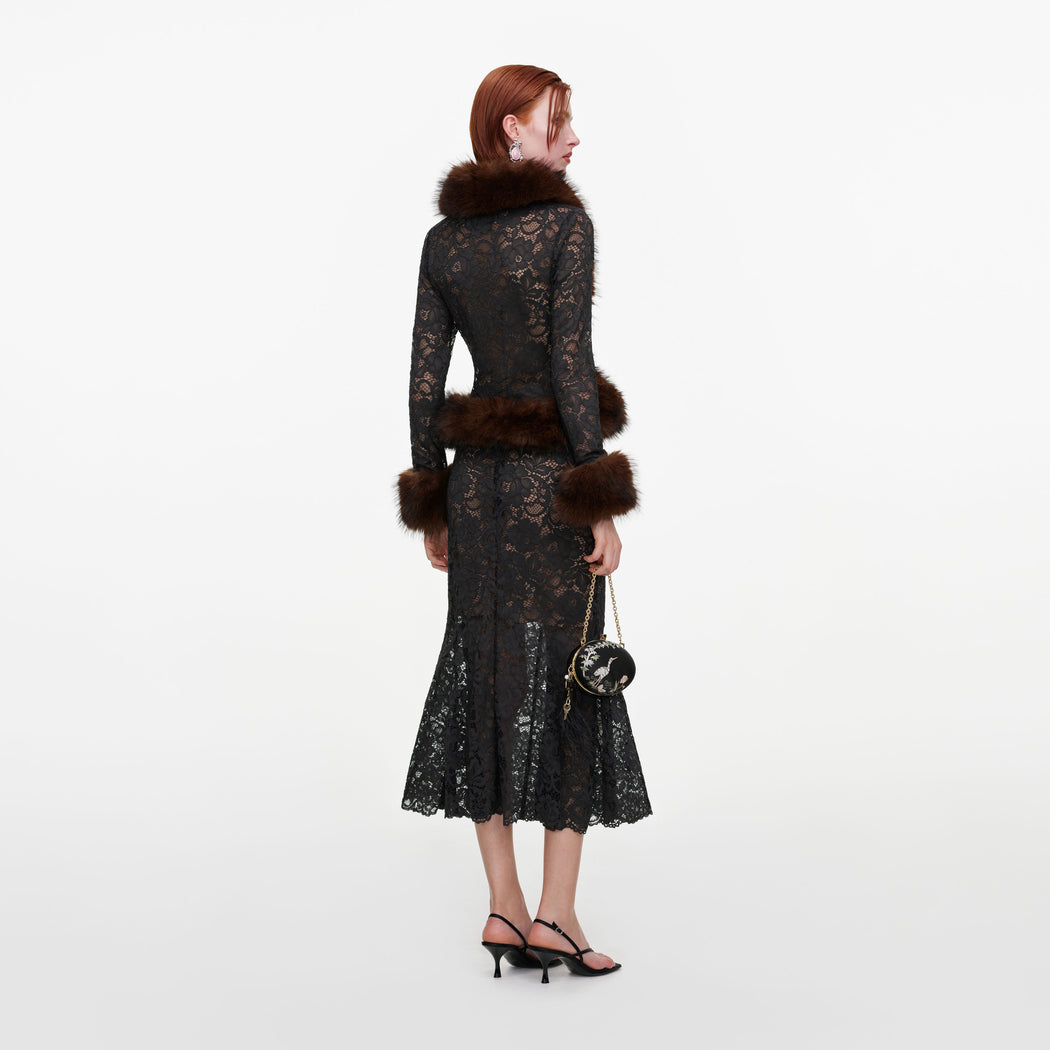 Back view of a woman wearing the Grey Lace Midi Skirt