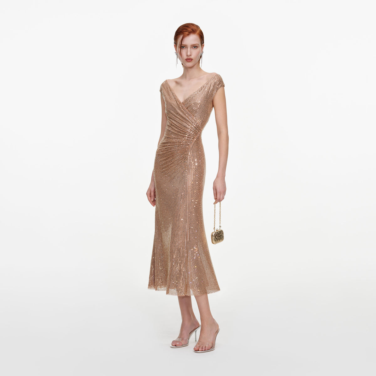 Side view of a woman wearing the Gold Rhinestone Off Shoulder Midi Dress