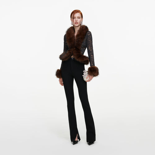 Front view of a woman wearing the Black Flared Knit Trousers