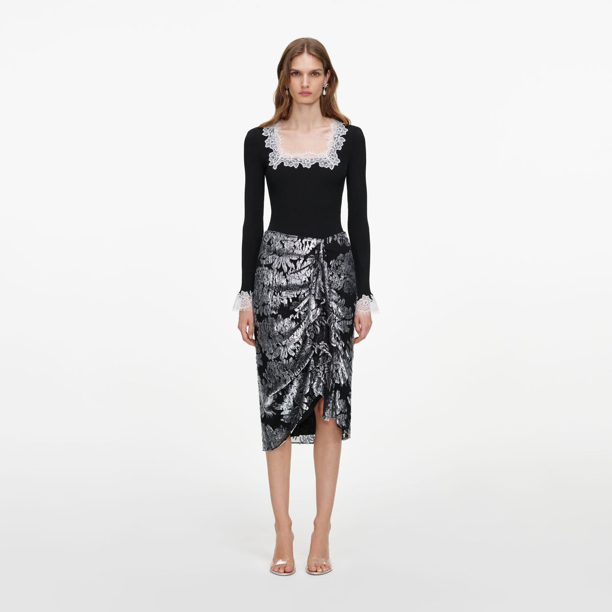 Front view of a woman wearing the Silver Fil Coupe Midi Skirt