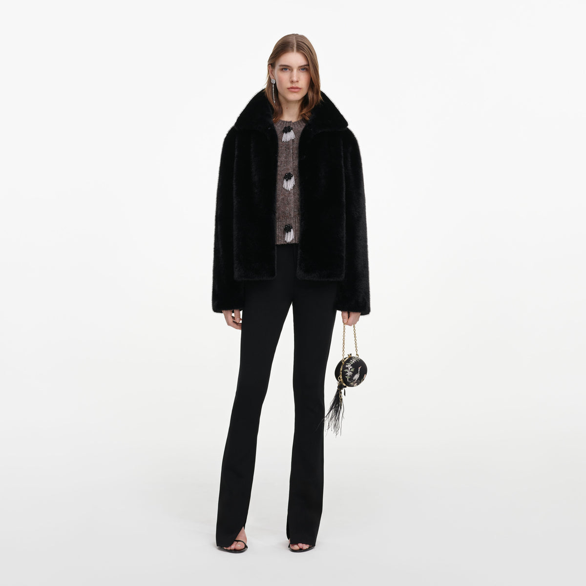 Front view of a woman wearing the Black Faux Fur Jacket