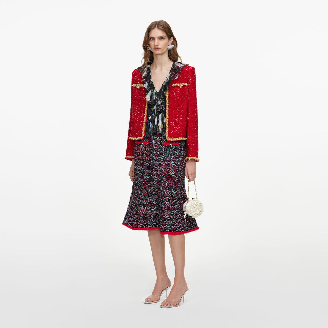 Side view of a woman wearing the Red Sequin Jacket