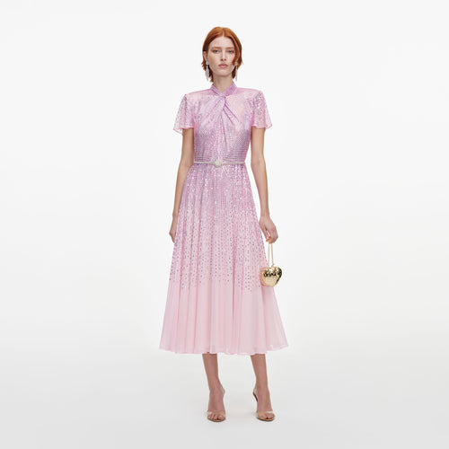Front view of a woman wearing the Pink Ombre Rhinestone Twist Midi Dress