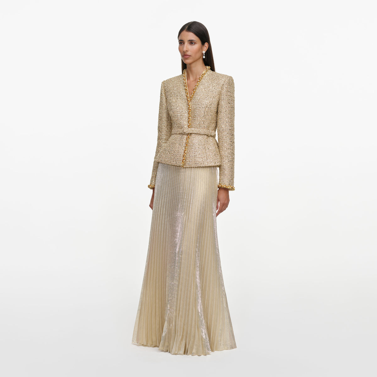 Side view of a woman wearing the Gold Boucle Pleated Maxi Dress