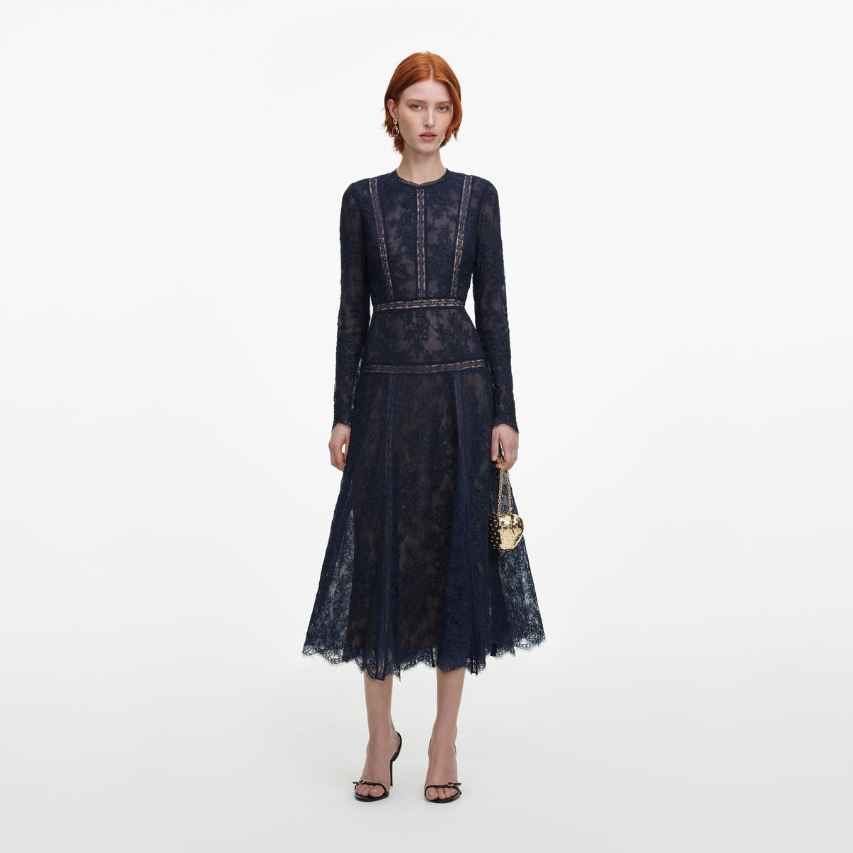 Front view of a woman wearing the Navy Lace Midi Dress