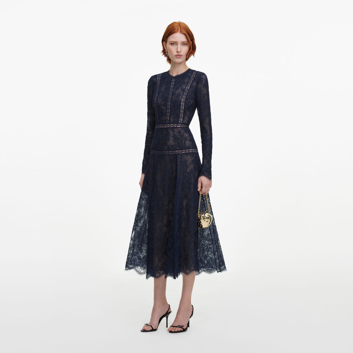 Side view of a woman wearing the Navy Lace Midi Dress