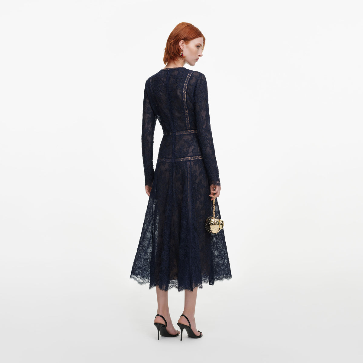 Back view of a woman wearing the Navy Lace Midi Dress