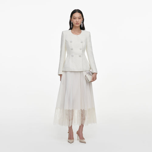 Front view of a woman wearing the Cream Boucle Wrap Midi Dress