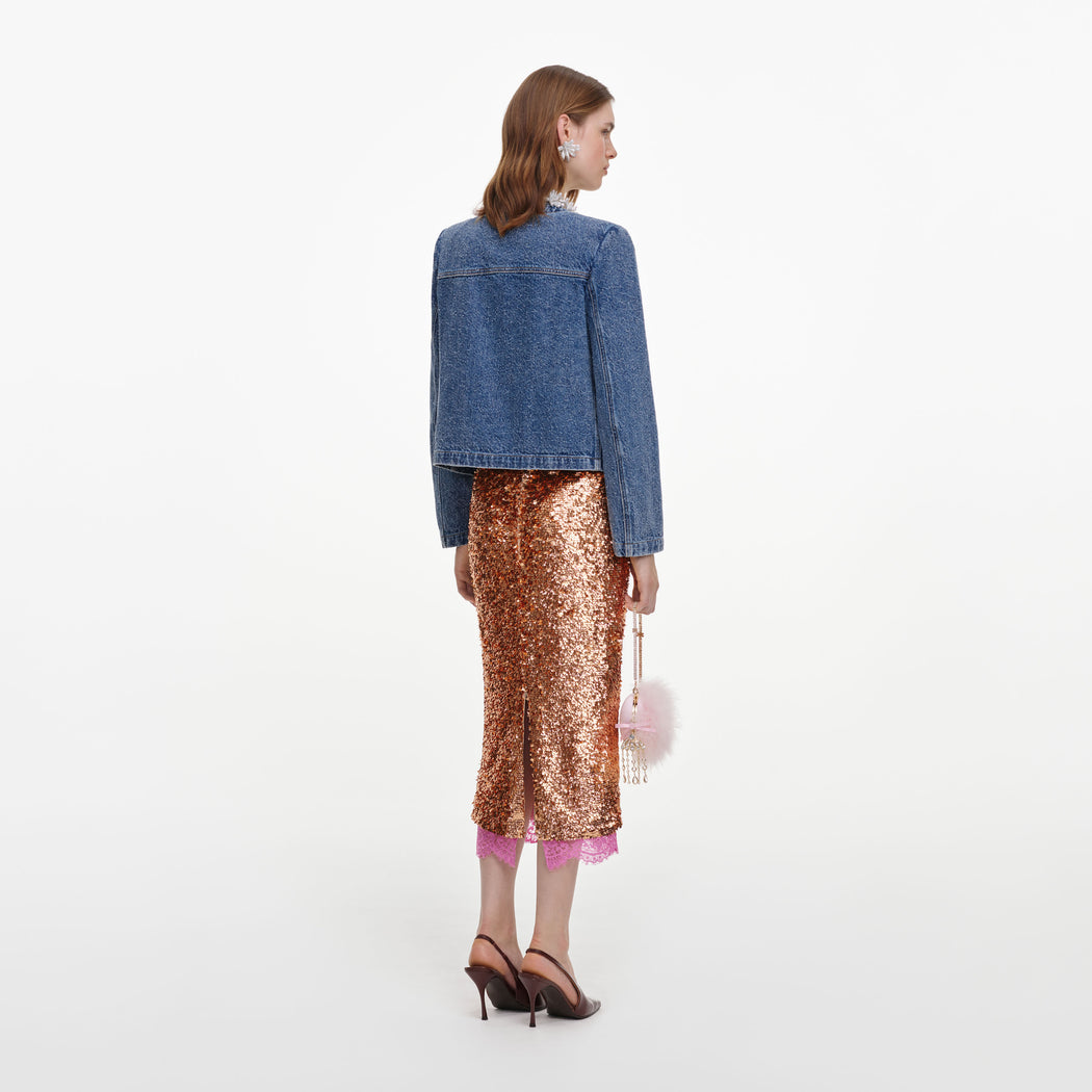 Back view of a woman wearing the Textured Denim Jacket