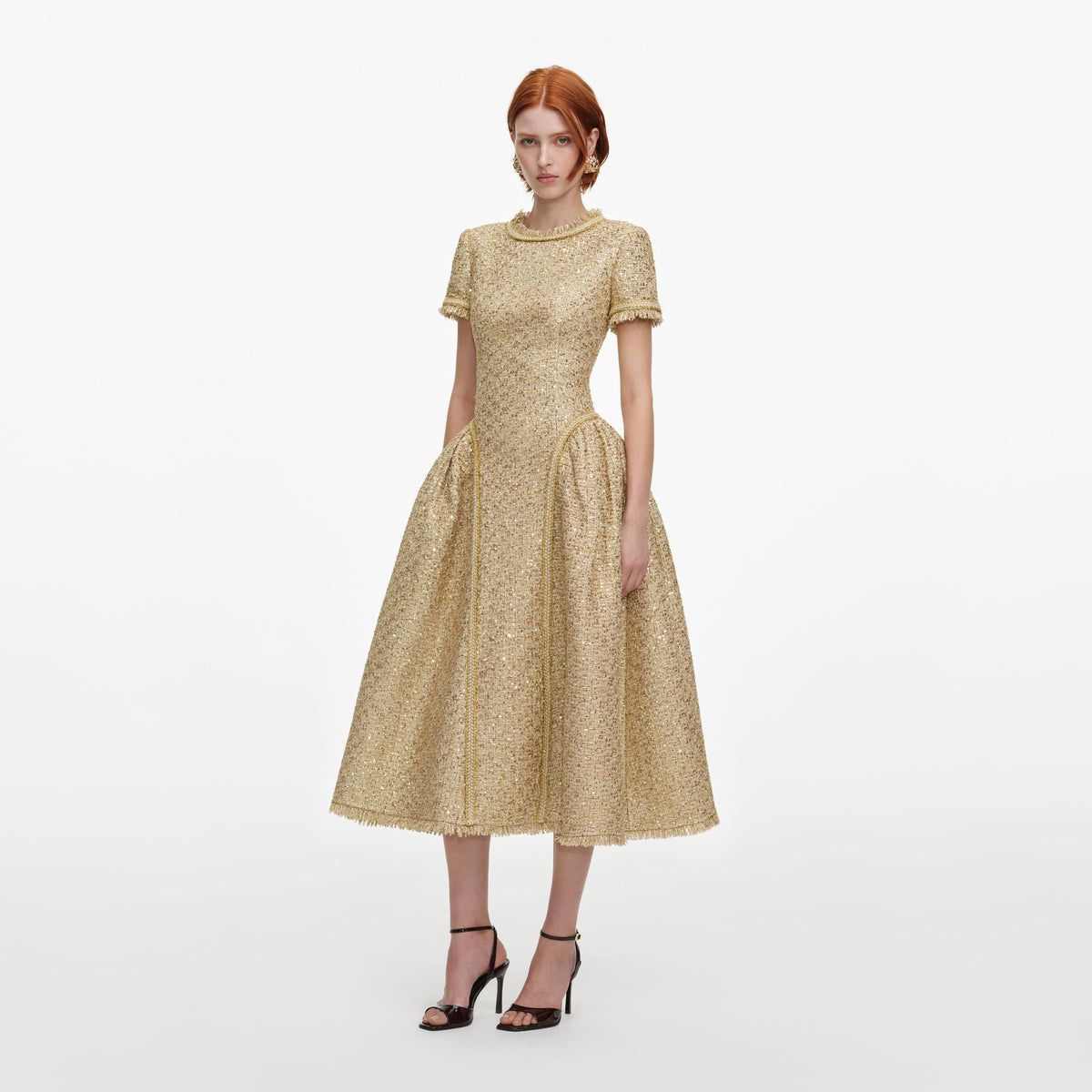 Side view of a woman wearing the Gold Sequin Boucle Midi Dress