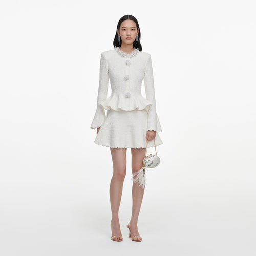 Front view of a woman wearing the White Textured Knit Mini Dress