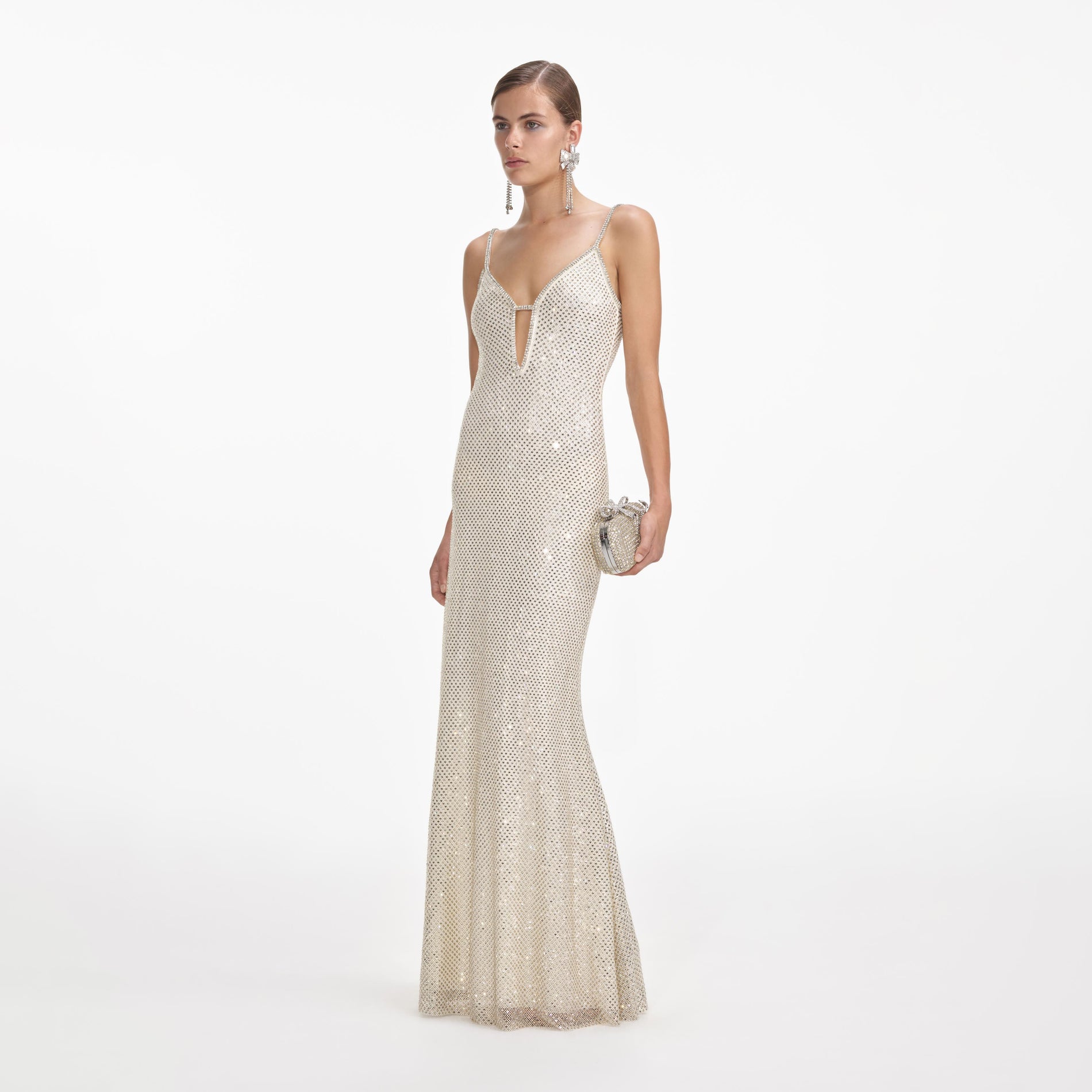 Side view of a woman wearing the Cream Square Rhinestone Fishnet Maxi Dress