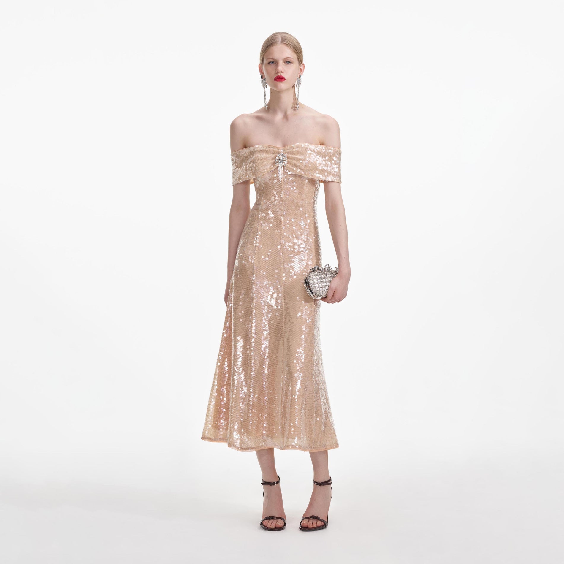 Front view of a woman wearing the Gold Sequin Off Shoulder Midi Dress