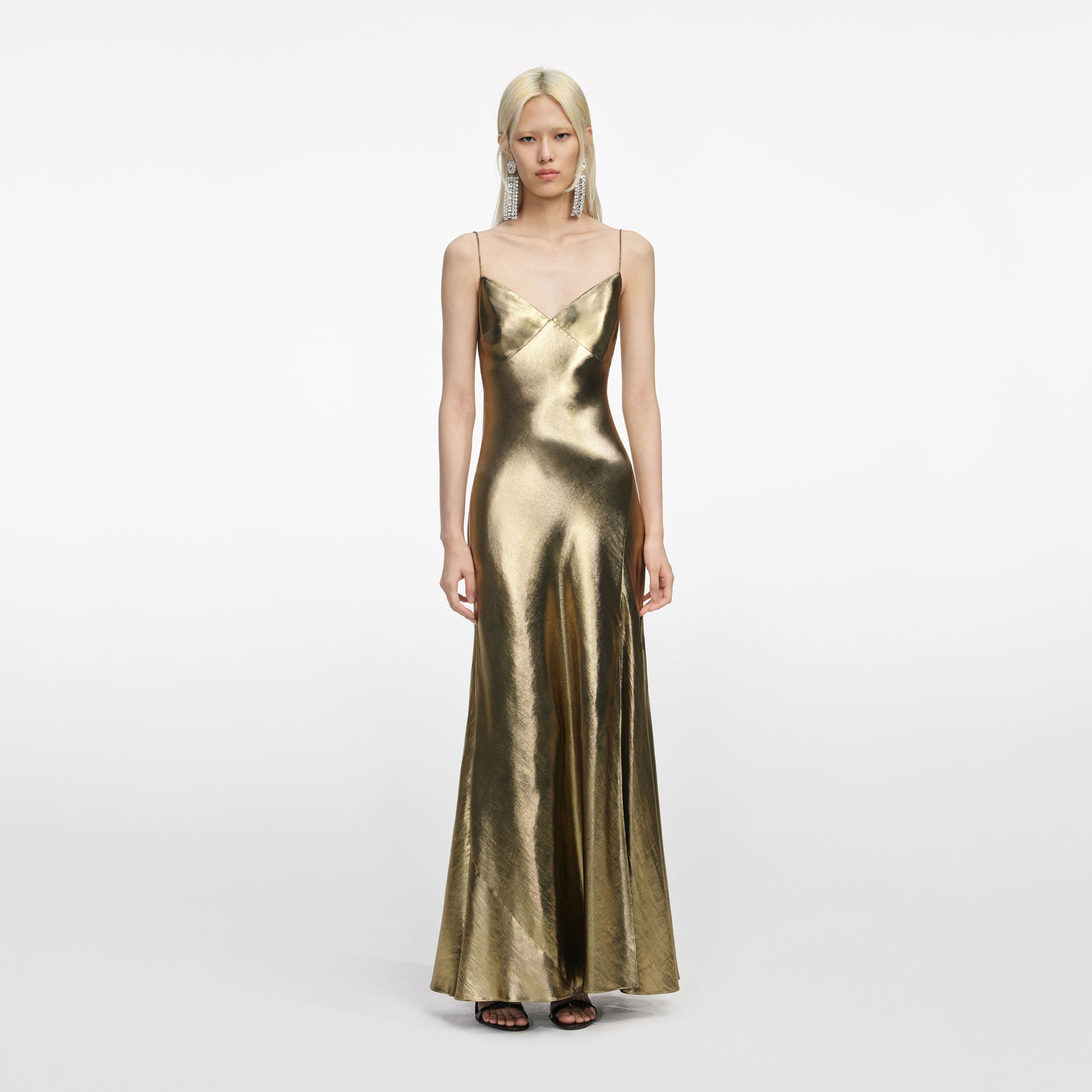 Front view of a woman wearing the Gold Metallic Strappy Maxi Dress