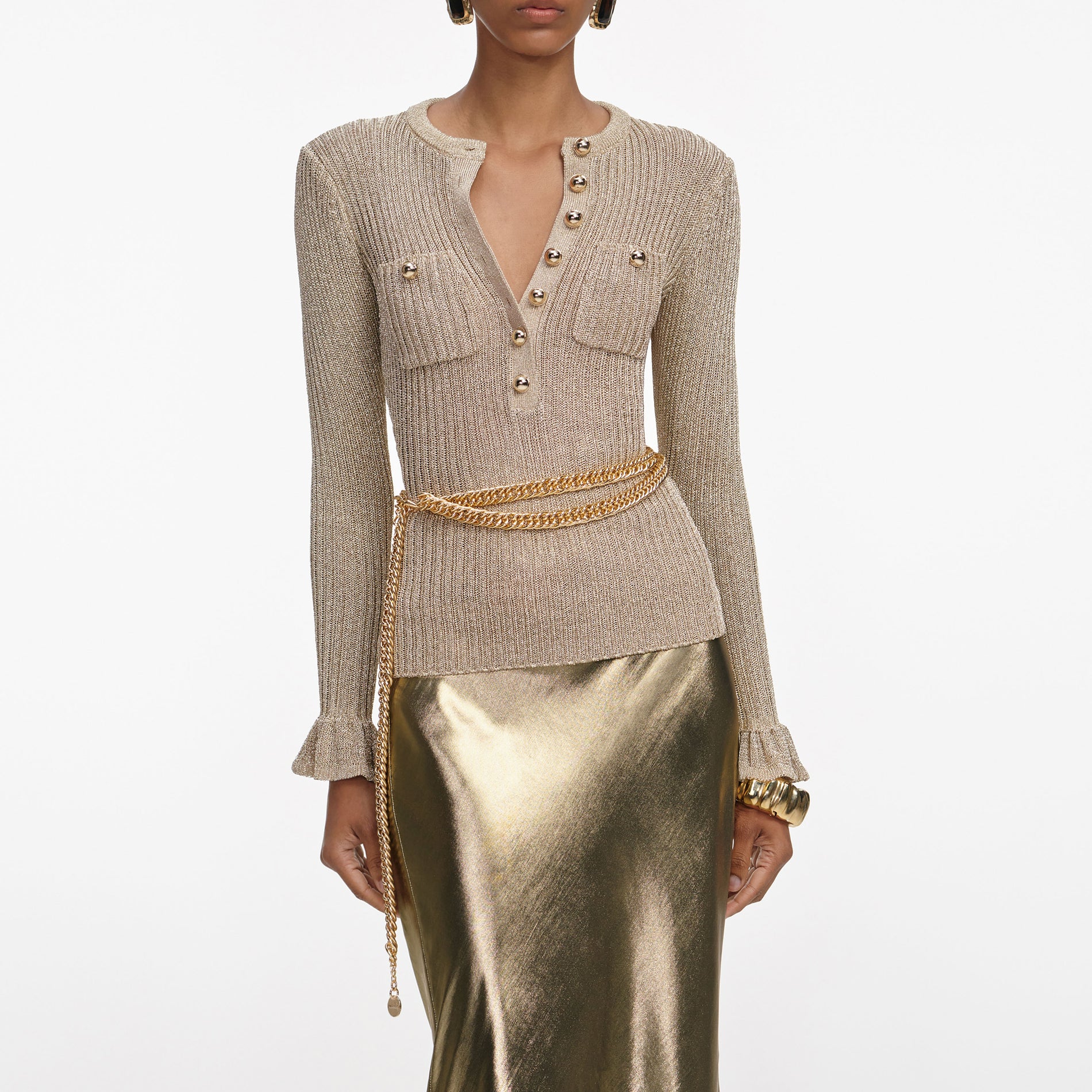 A close up of a woman wearing the Gold Lurex Ribbed Knit Top