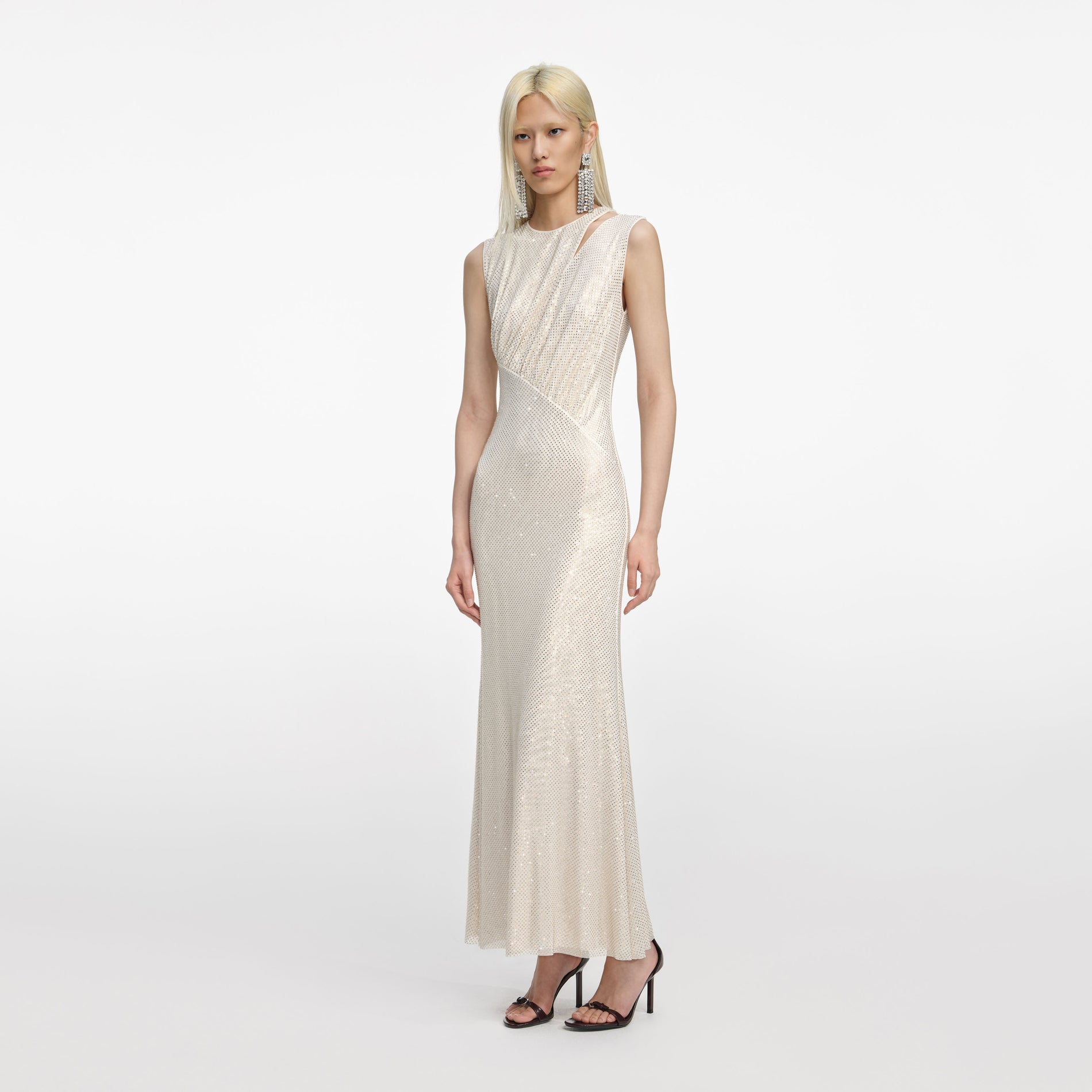 Side view of a woman wearing the Champagne Rhinestone Cut Out Midi Dress