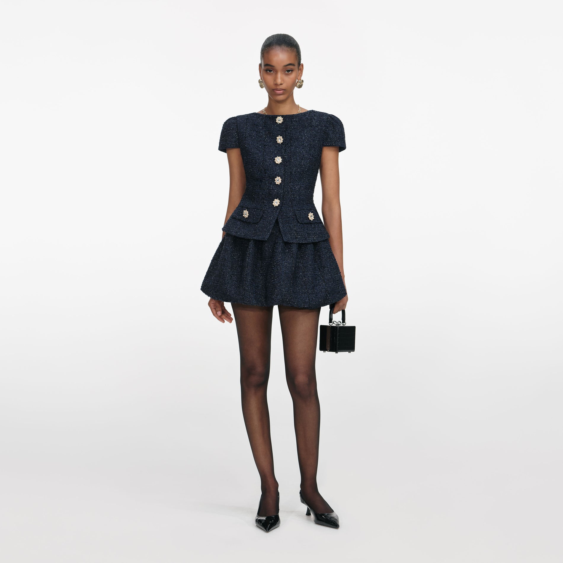 Front view of a woman wearing the Navy Boucle Mini Dress