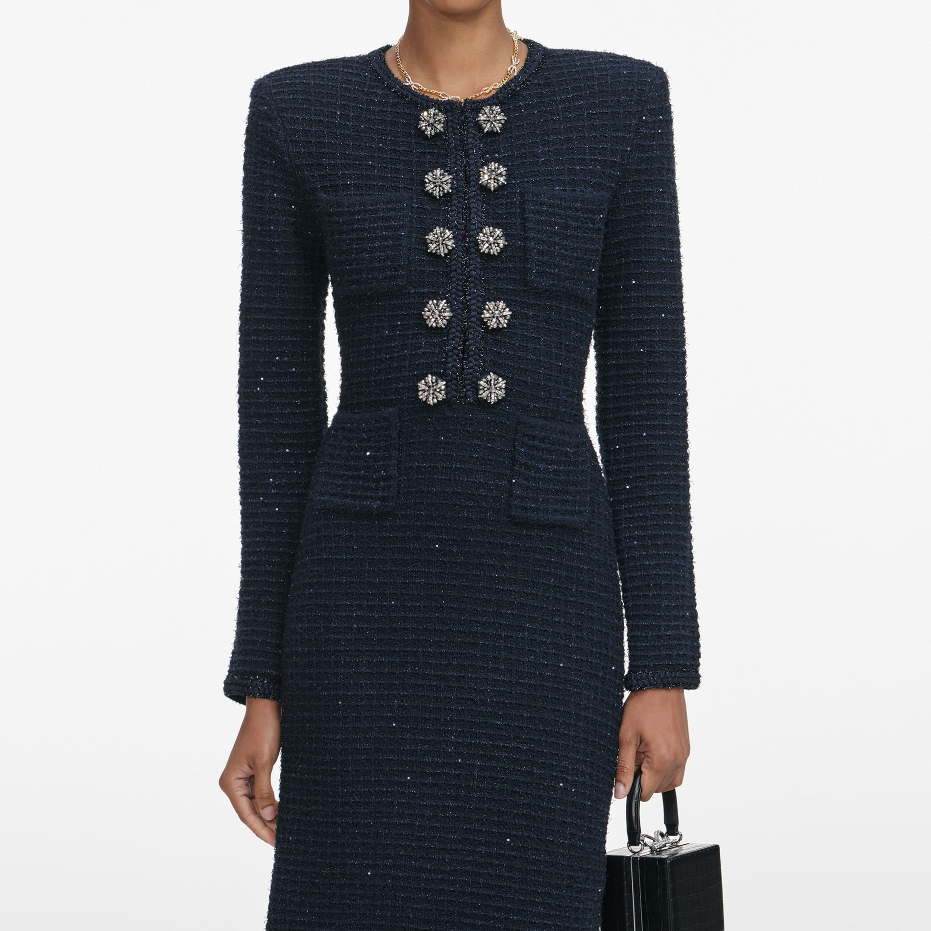 A close up of a woman wearing the Navy Textured Knit Midi Dress