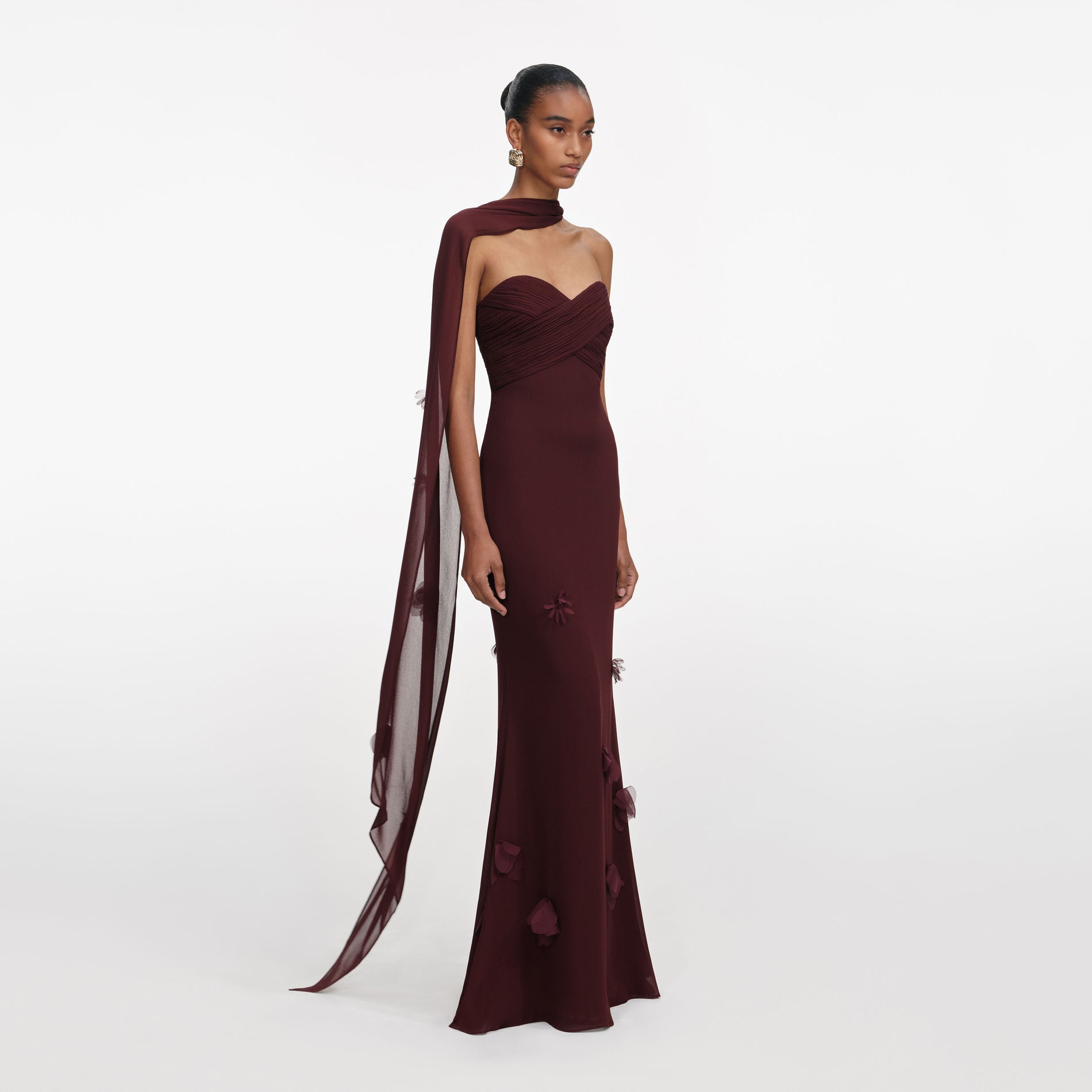 Side view of a woman wearing the Brown Georgette Flower Maxi Dress