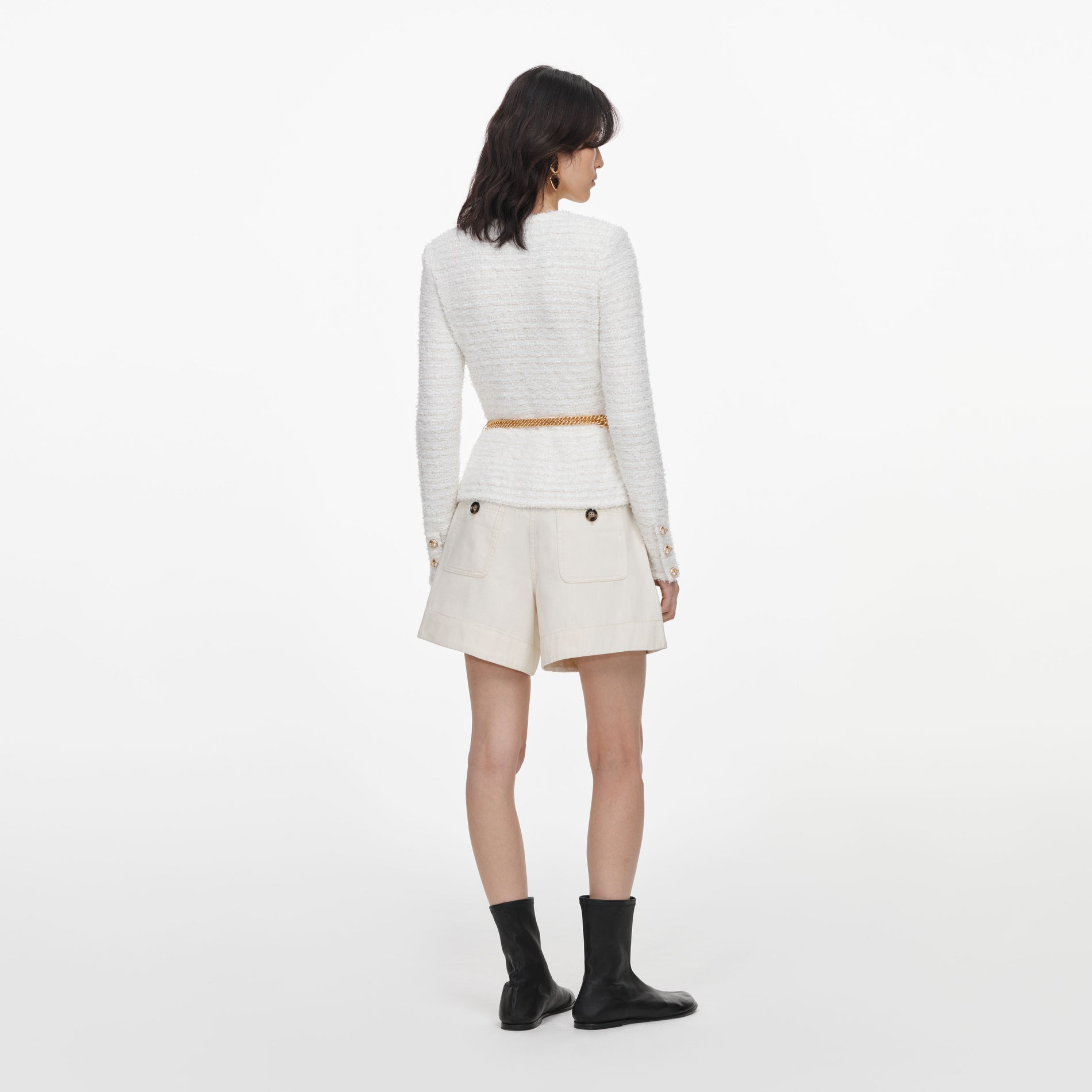 Back view of a woman wearing the Cream Textured Knit Cardigan