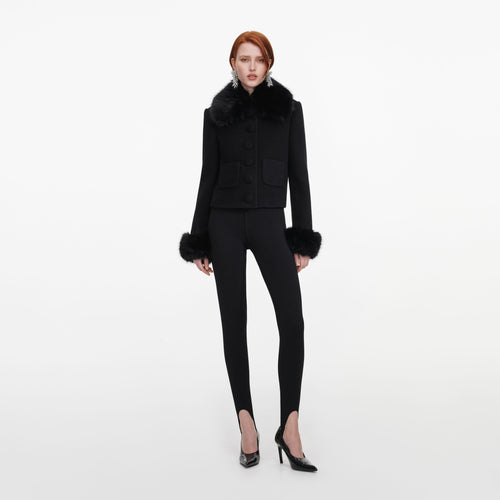 Front view of a woman wearing the Black Wool Fur Cuff Jacket