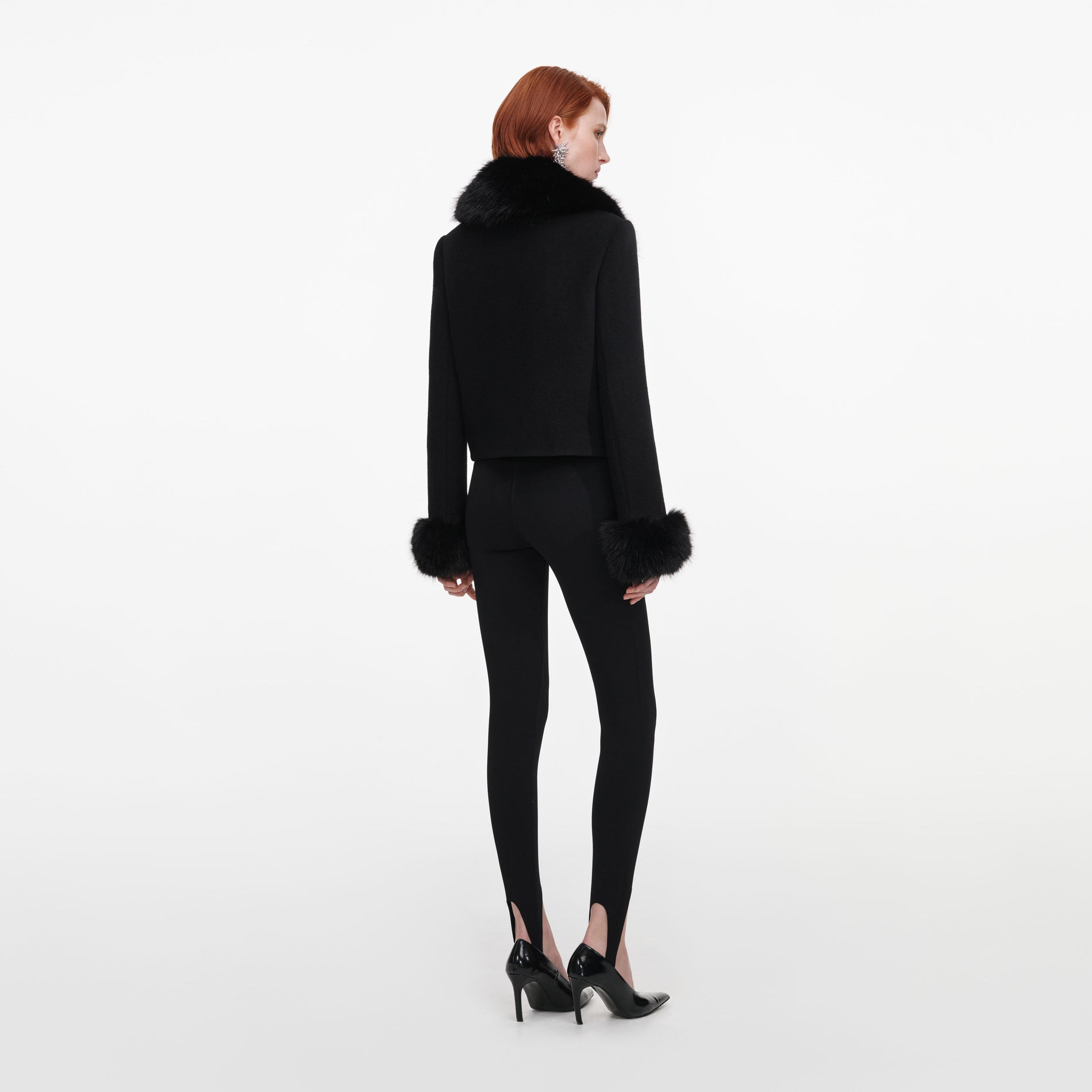 Back view of a woman wearing the Black Wool Fur Cuff Jacket