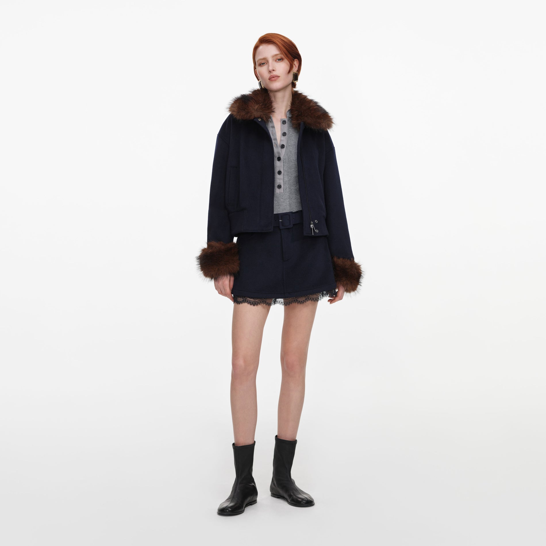 Front view of a woman wearing the Navy Wool Fur Trim Jacket