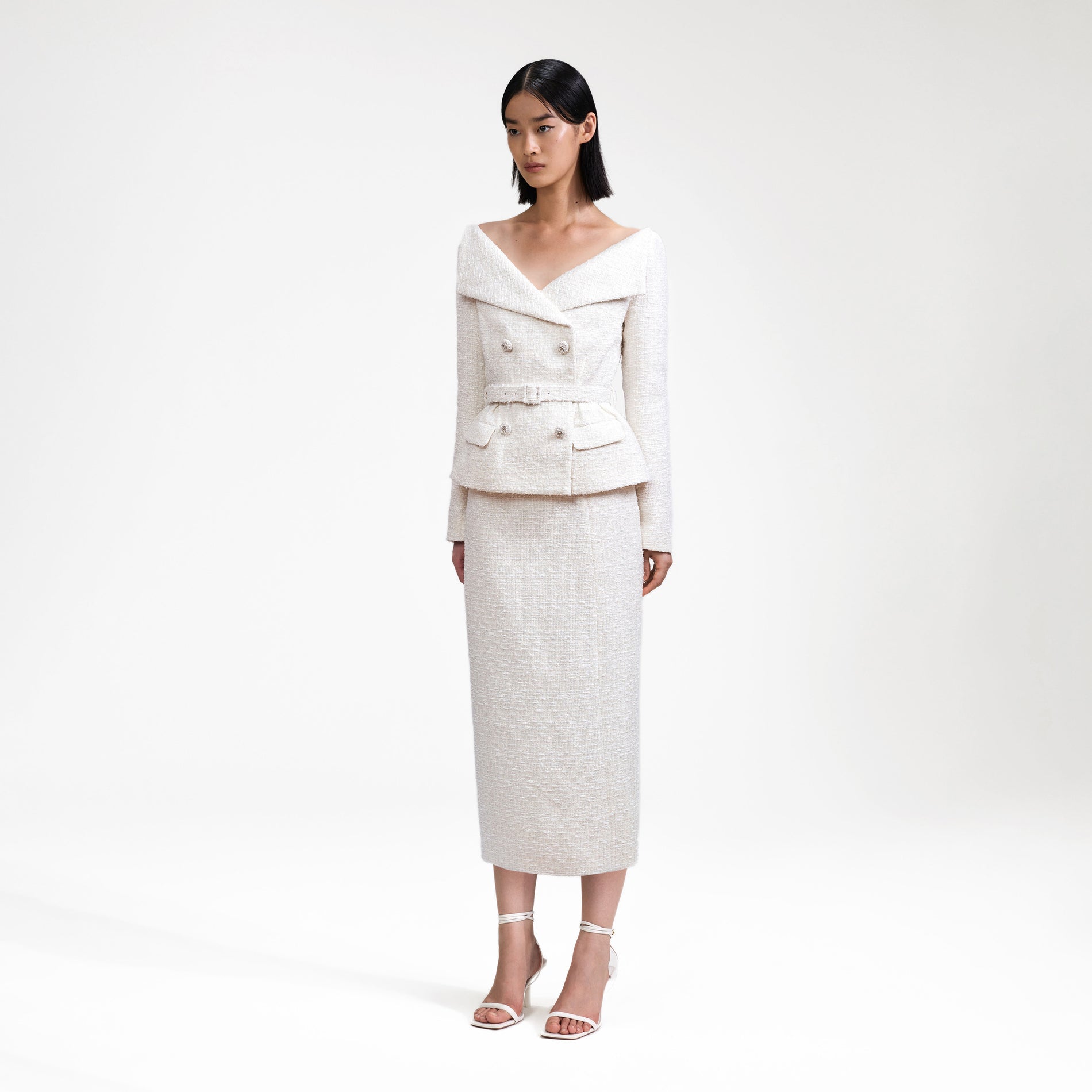 Side view of a woman wearing the Cream Off Shoulder Boucle Midi Dress