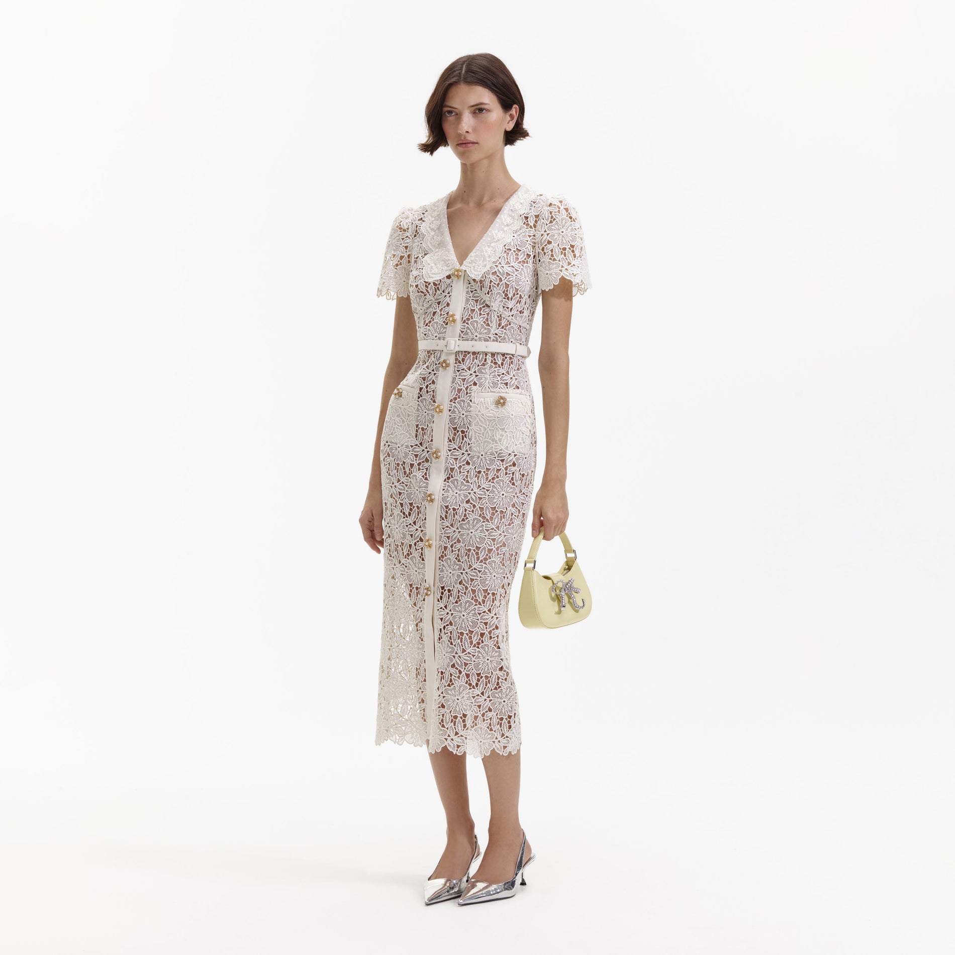 Side view of a woman wearing the Cream Lace Midi Dress
