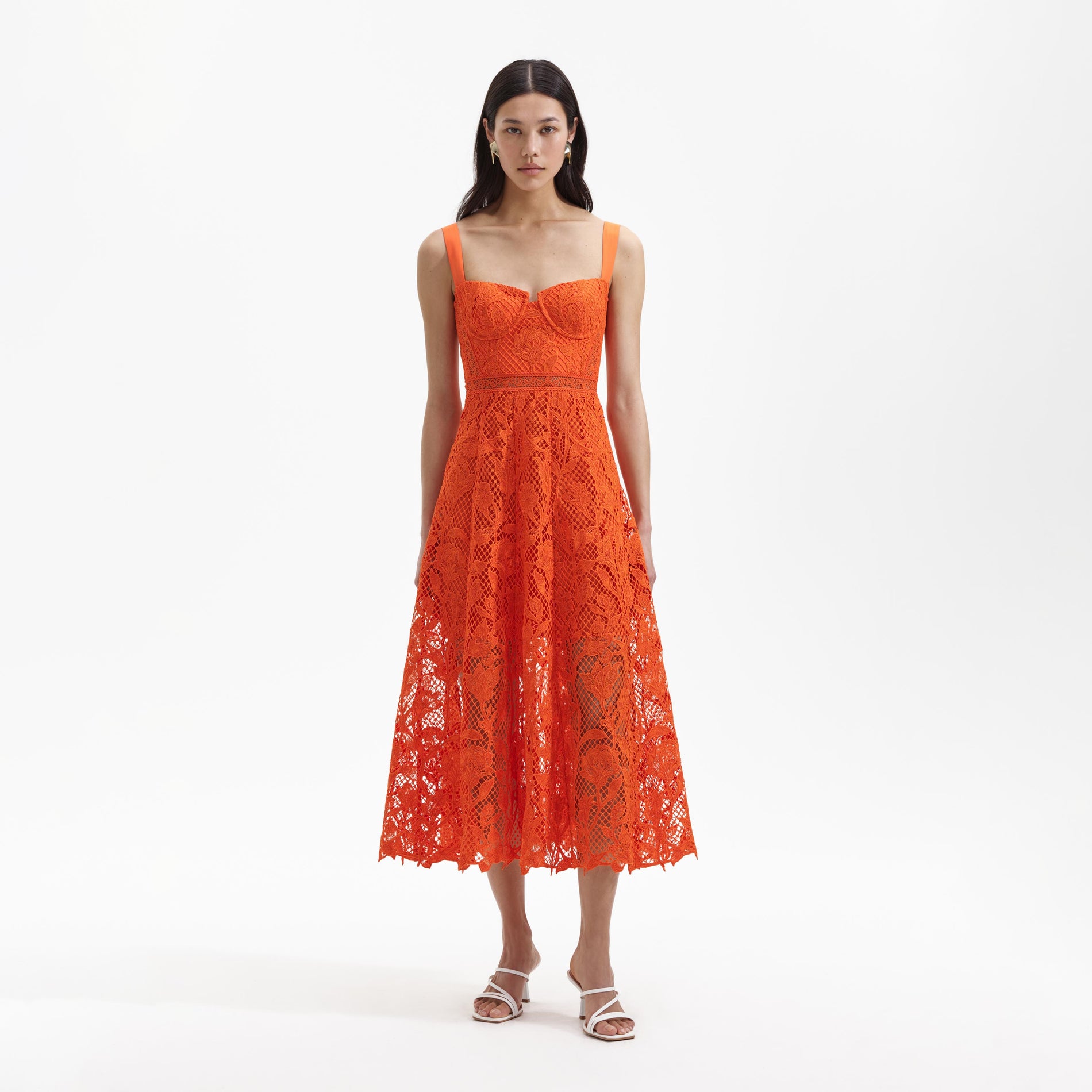 Front view of a woman wearing the Orange Lace Midi Dress
