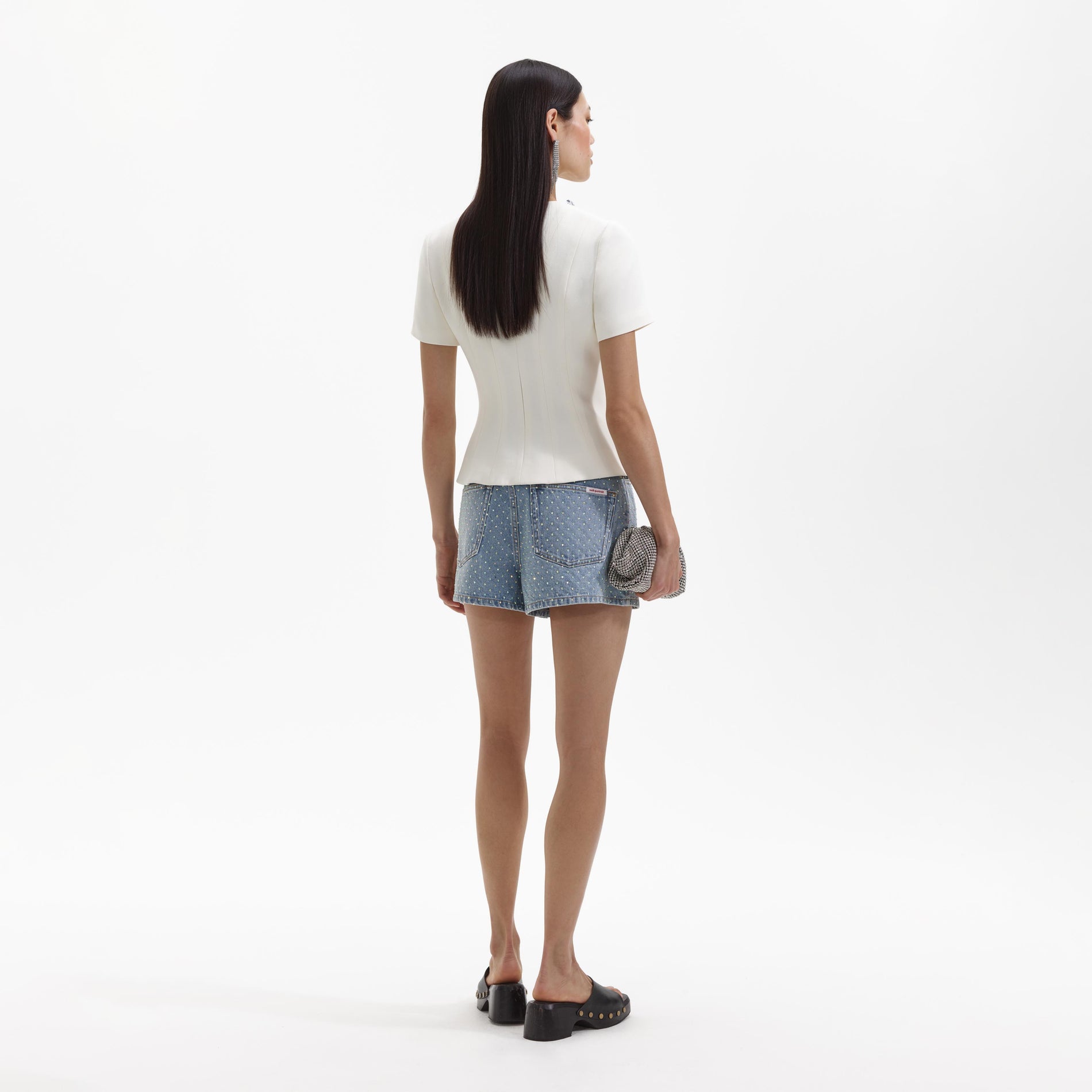 Back view of a woman wearing the Cream Crepe Embellished Top