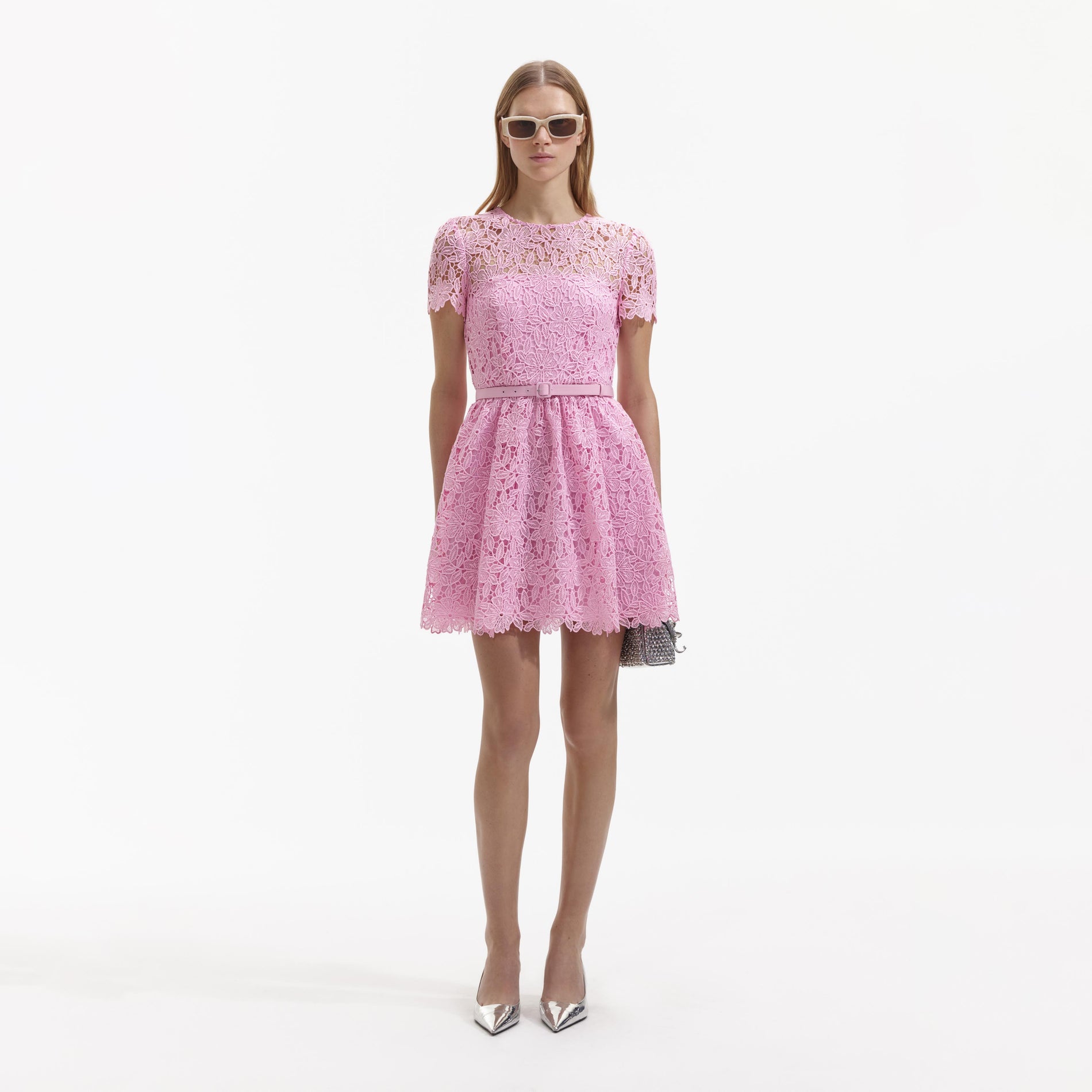 A Woman wearing the Pink Guipure Lace High Neck Mini Dress