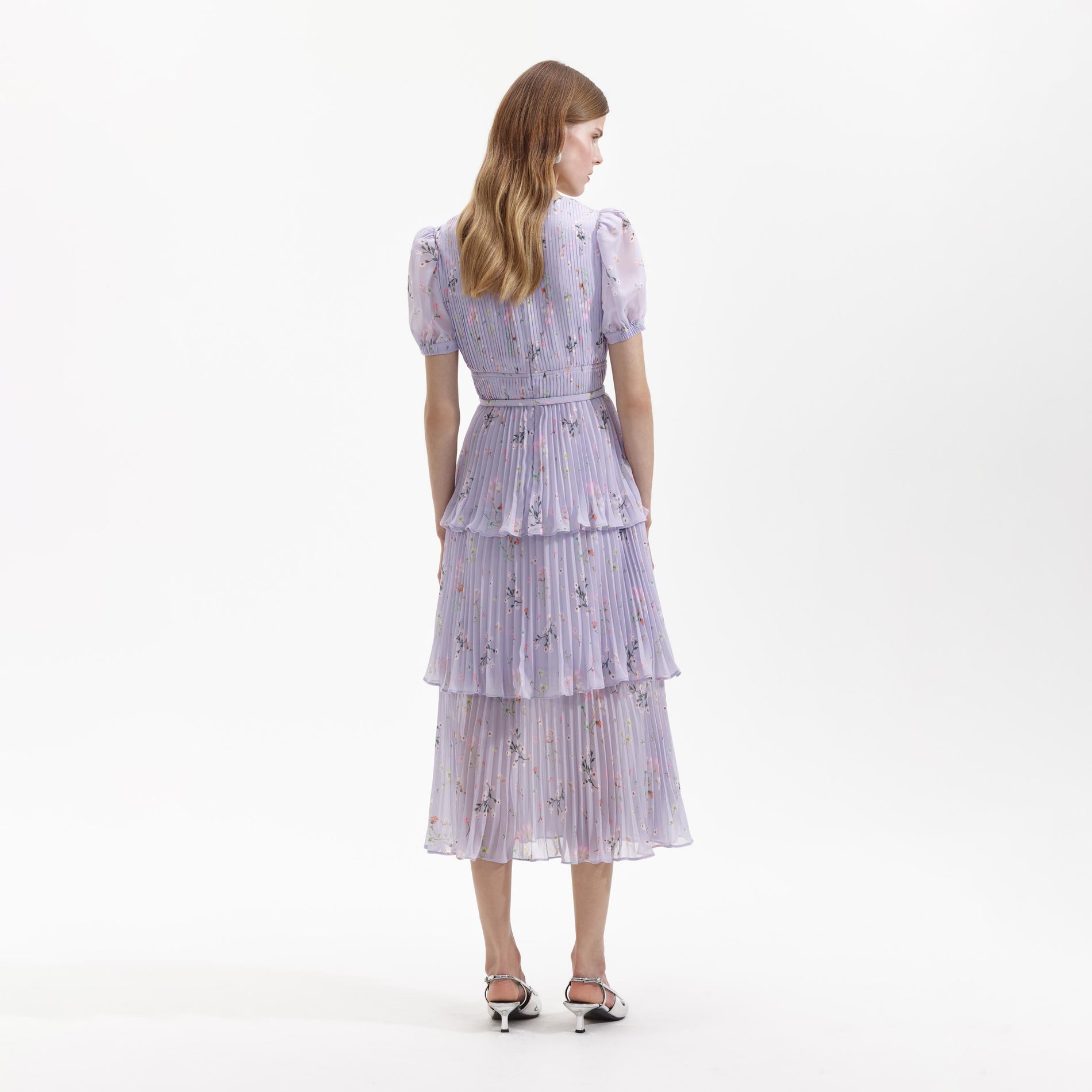 Back view of a woman wearing the Lilac Floral Midi Dress