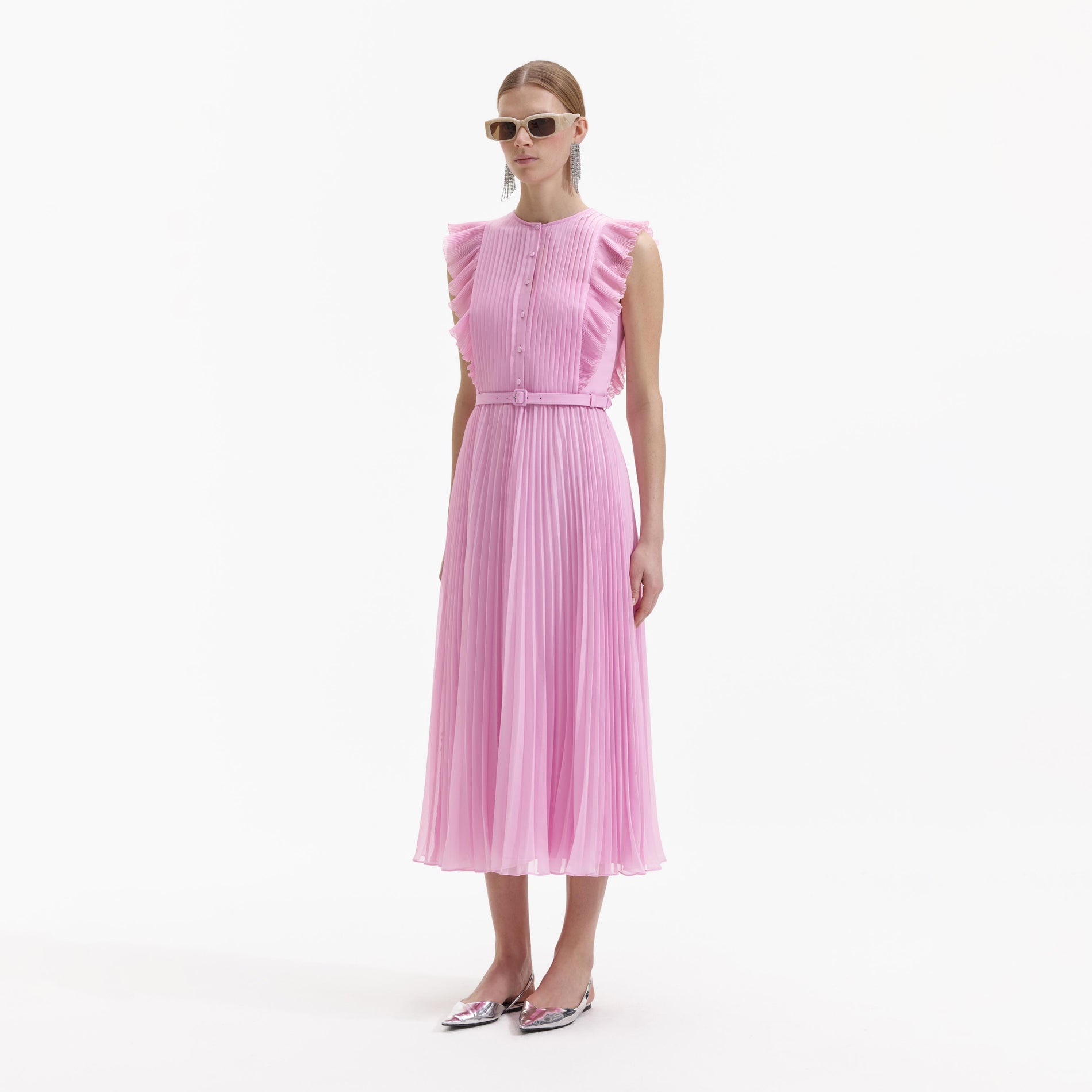 Side view of a woman wearing the Pink Chiffon Tunic Midi Dress