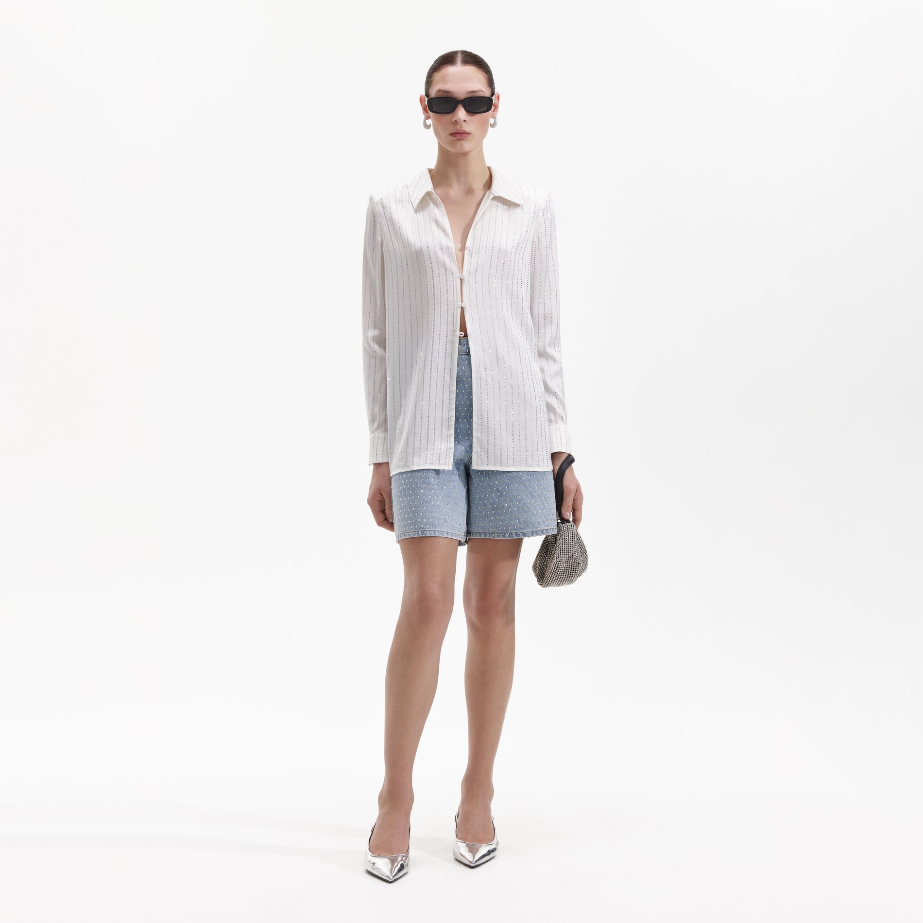 Front view of a woman wearing the White Rhinestone Stripe Shirt