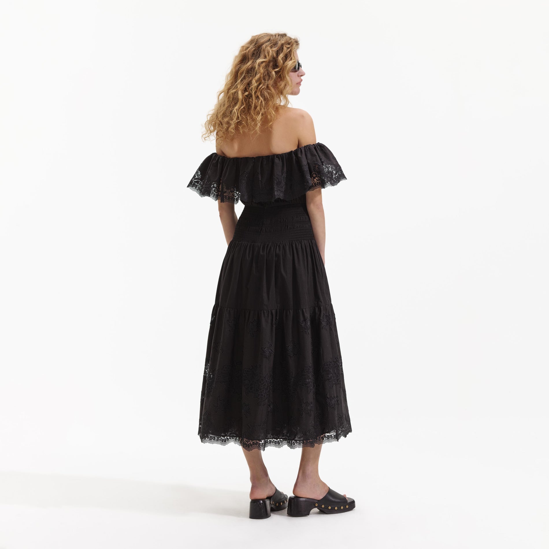Back view of a woman wearing the Black Cotton Midi Dress