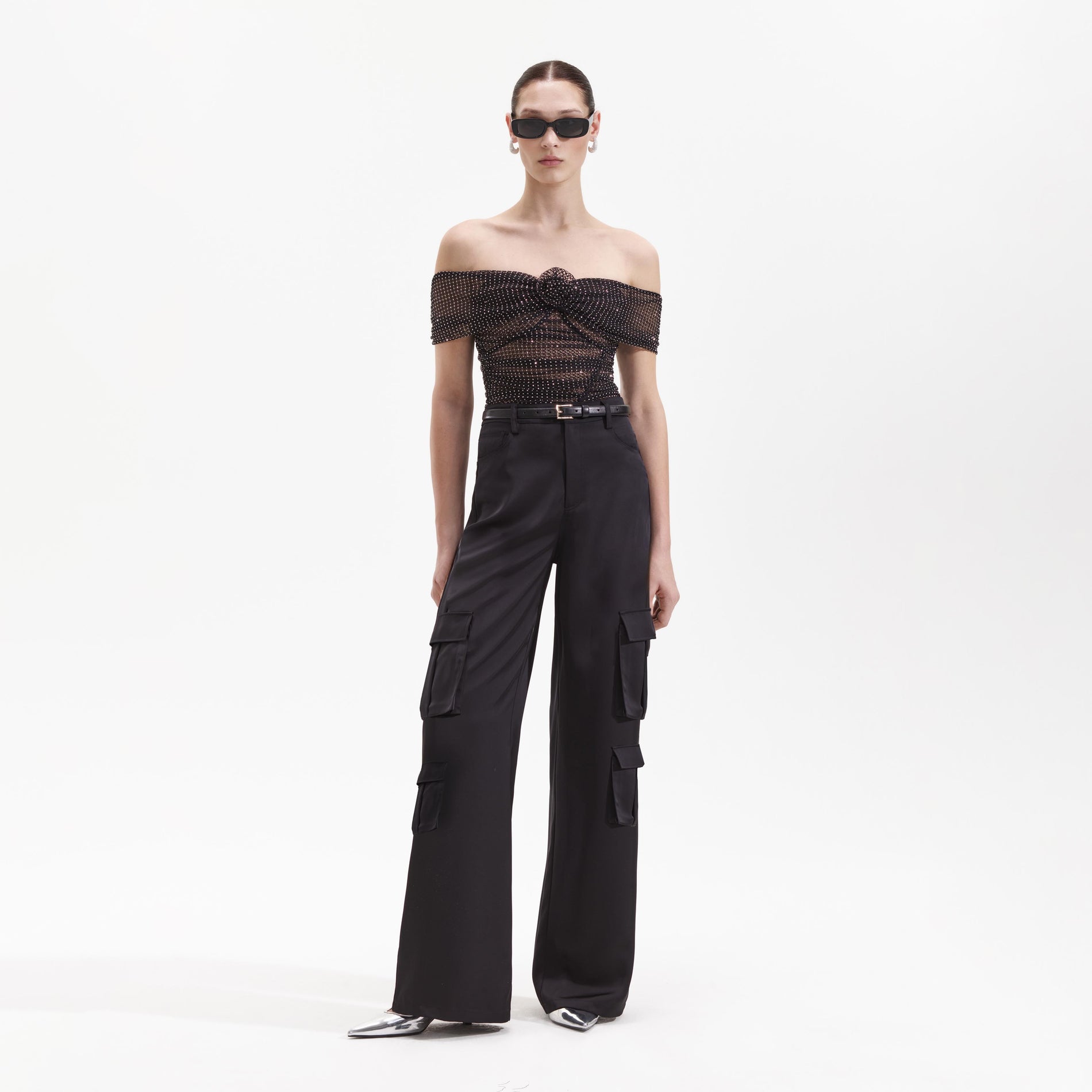 Front view of a woman wearing the Black Satin Cargo Trouser