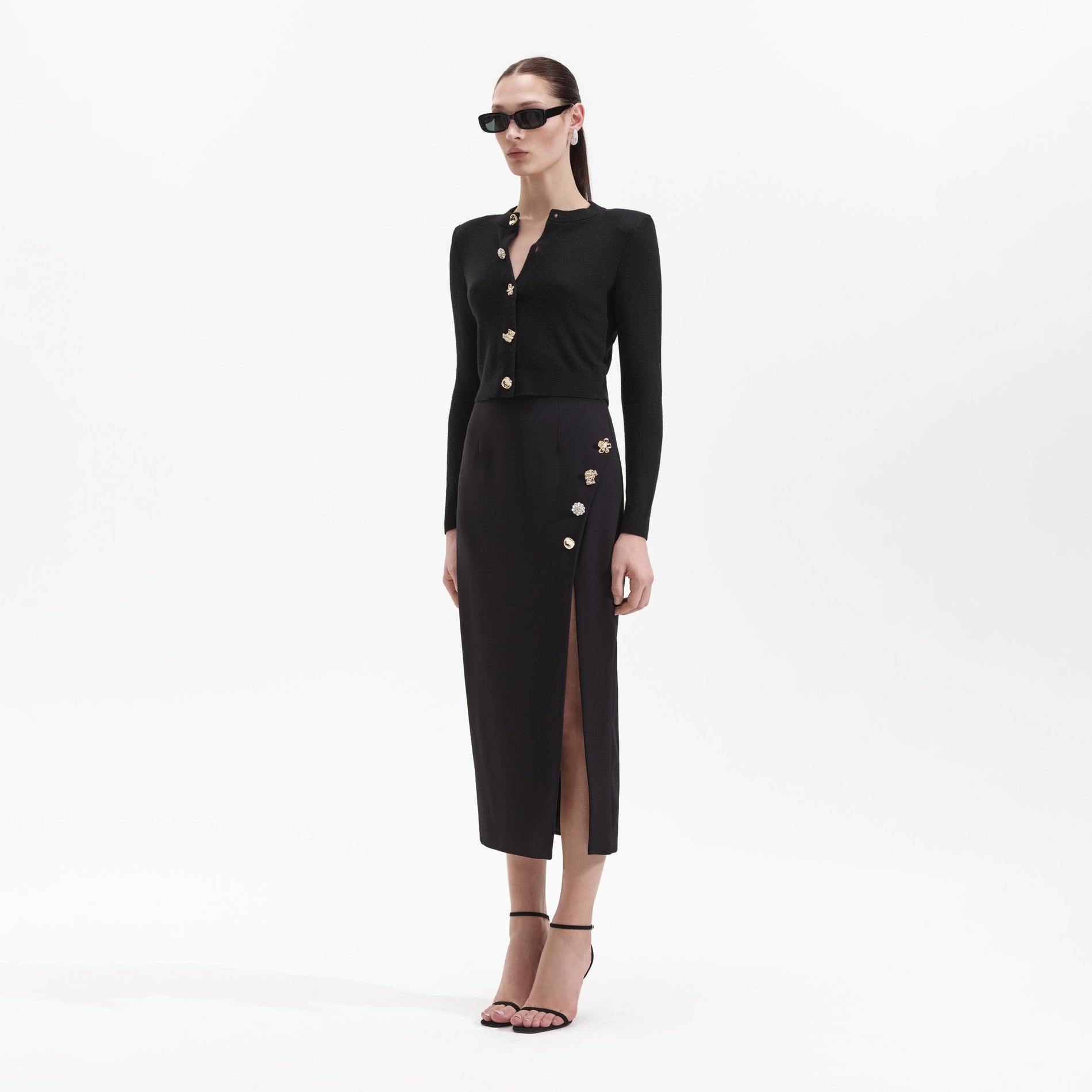 Side view of a woman wearing the Black Cashmere Blend Cardigan