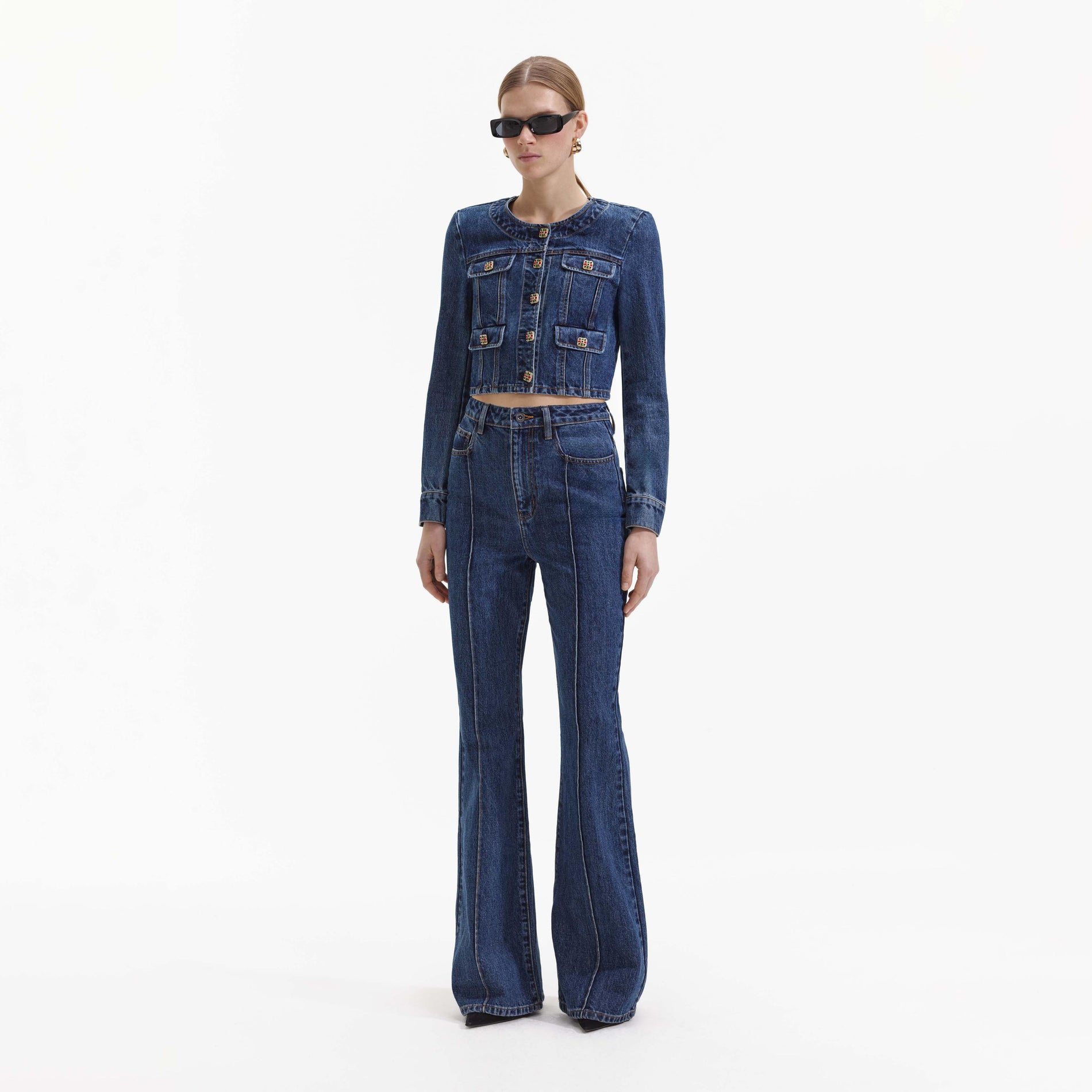 Side view of a woman wearing the Blue Bootcut Denim Jeans