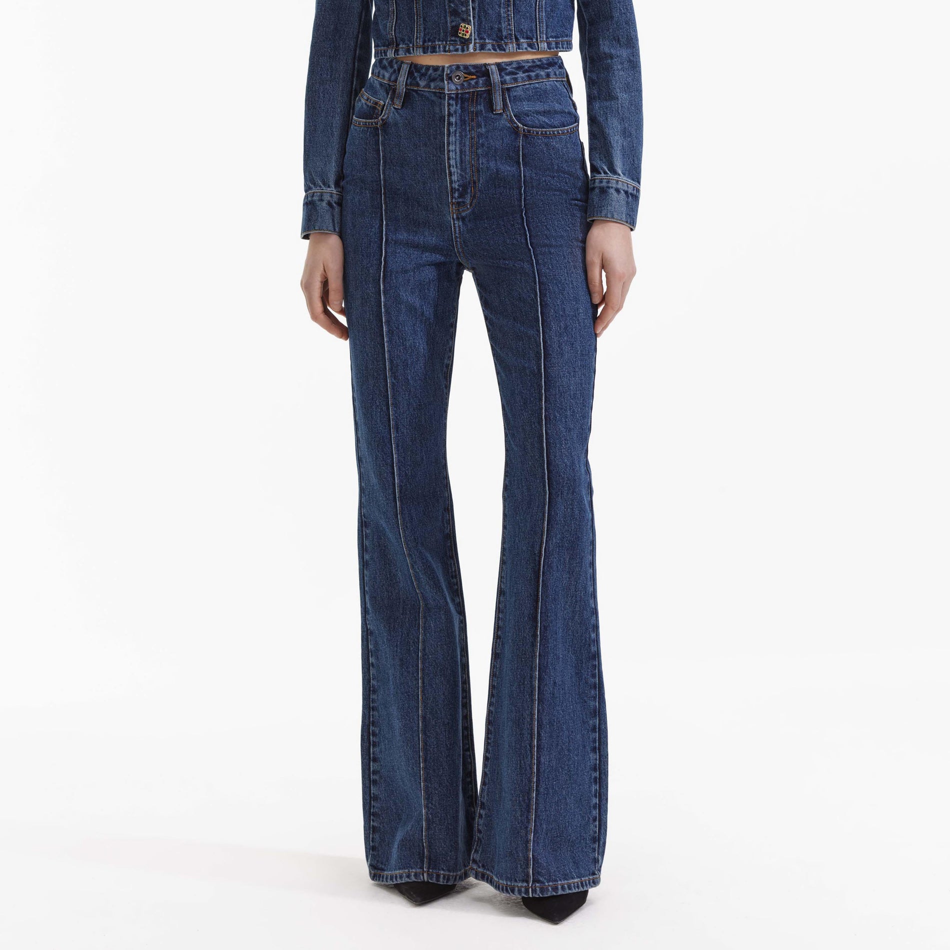 A close up of a woman wearing the Blue Bootcut Denim Jeans