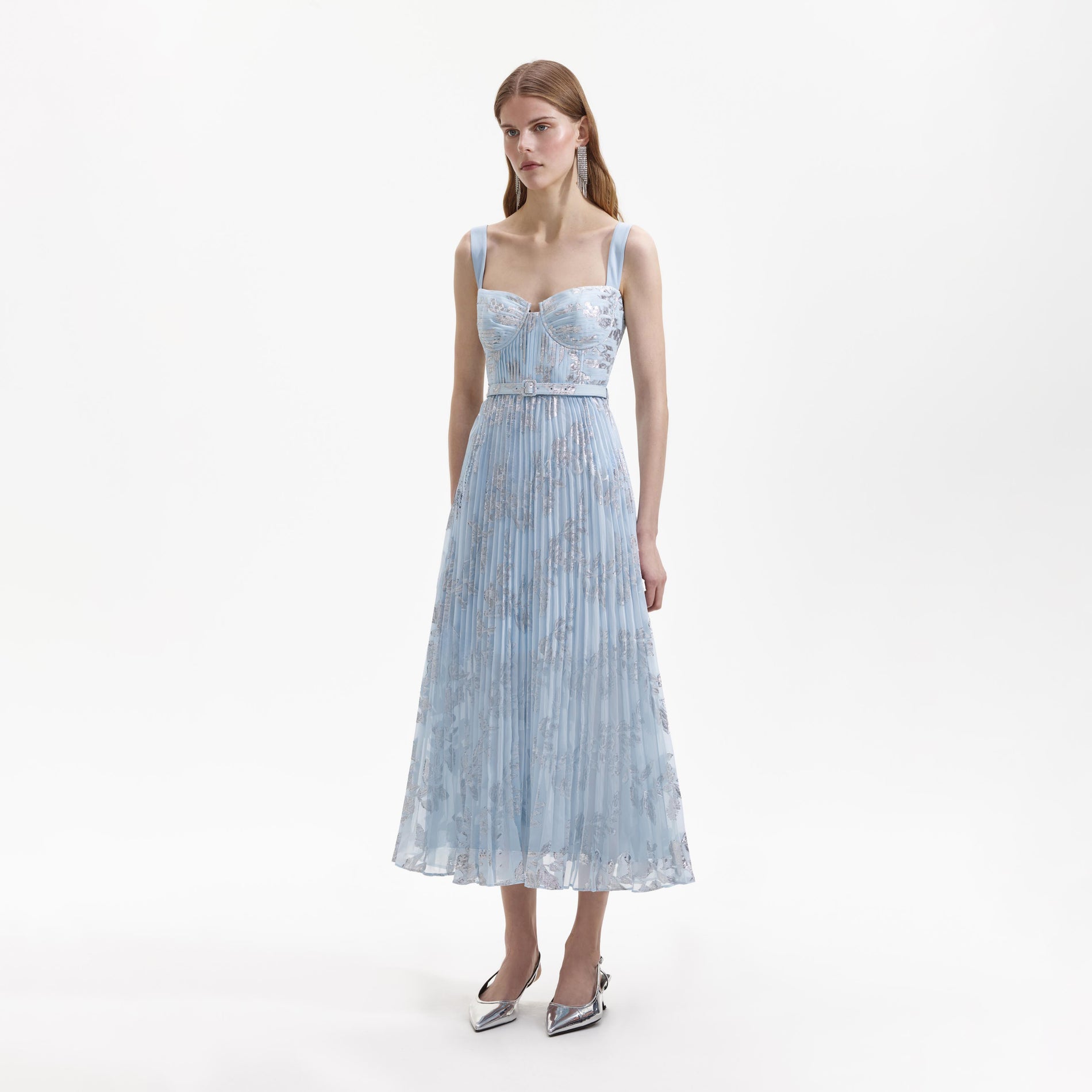 Side view of a woman wearing the Blue Pleated Midi Dress