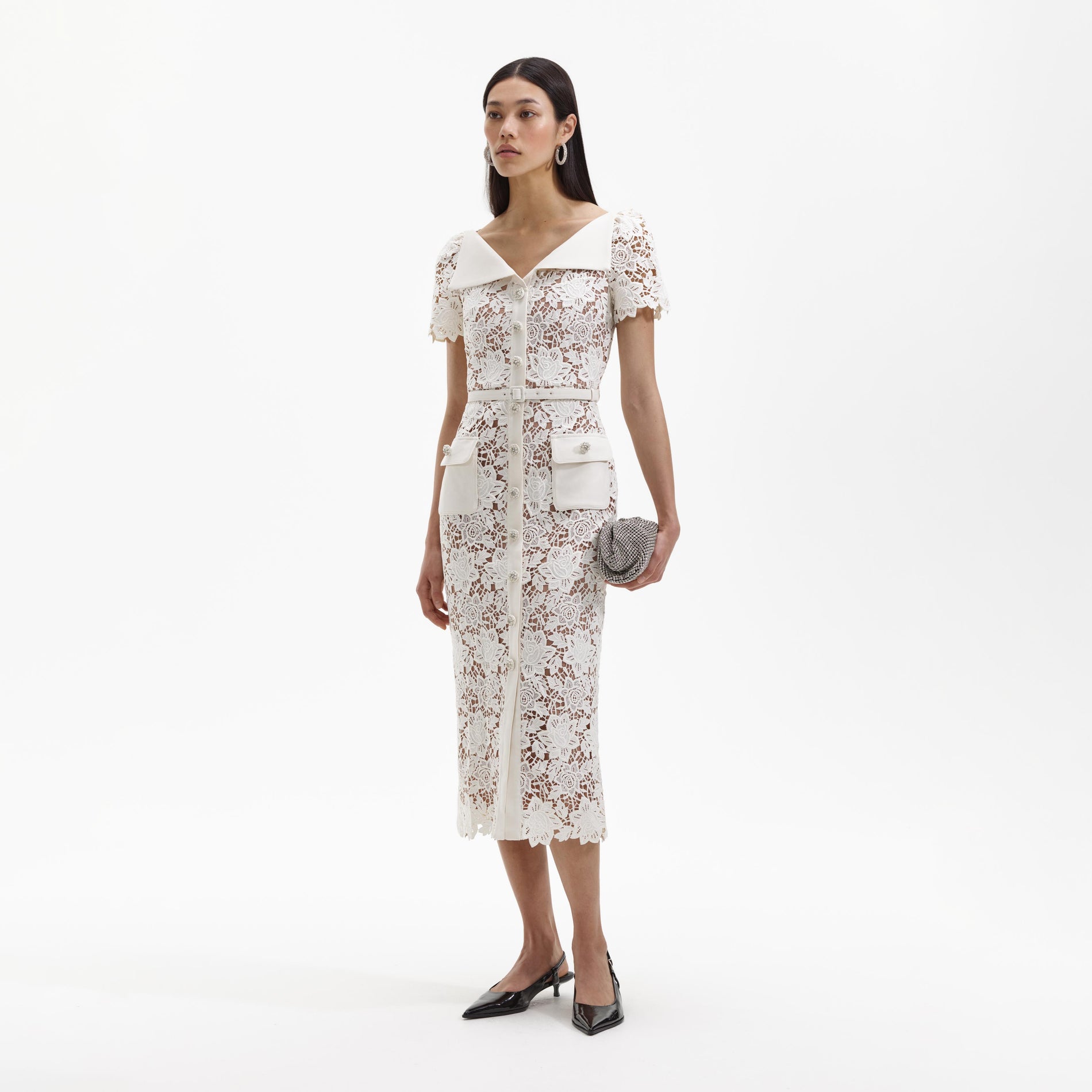 Side view of a woman wearing the White Lace Open Neck Midi Dress
