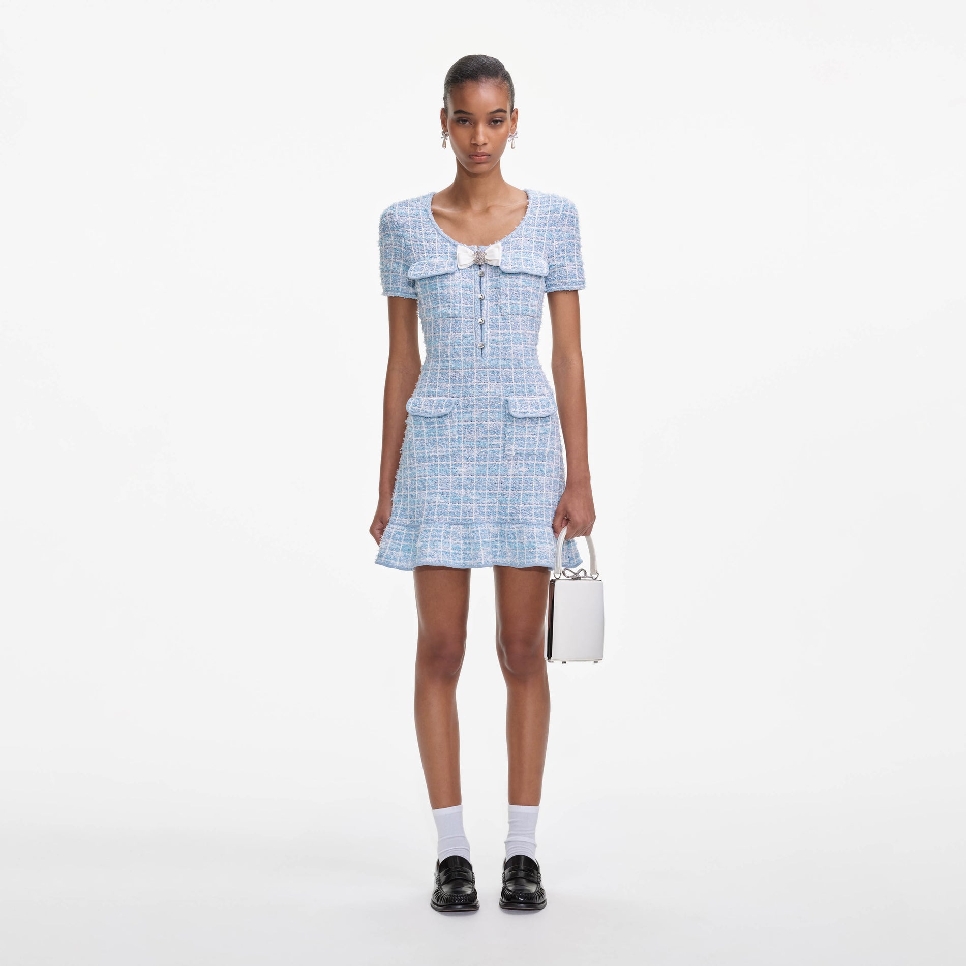 Front view of a woman wearing the Blue Check Knit Mini Dress