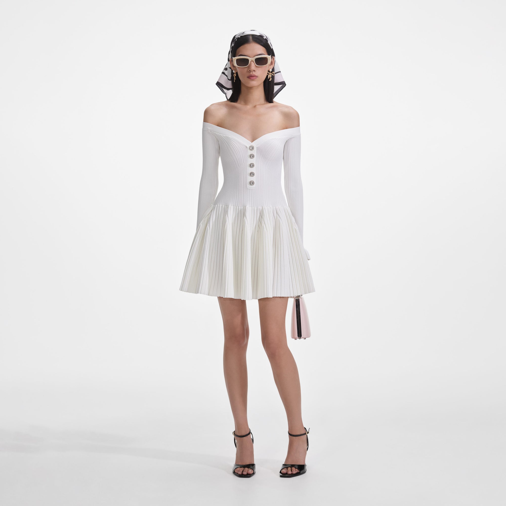 Front view of a woman wearing the White Ribbed Knit Mini Dress