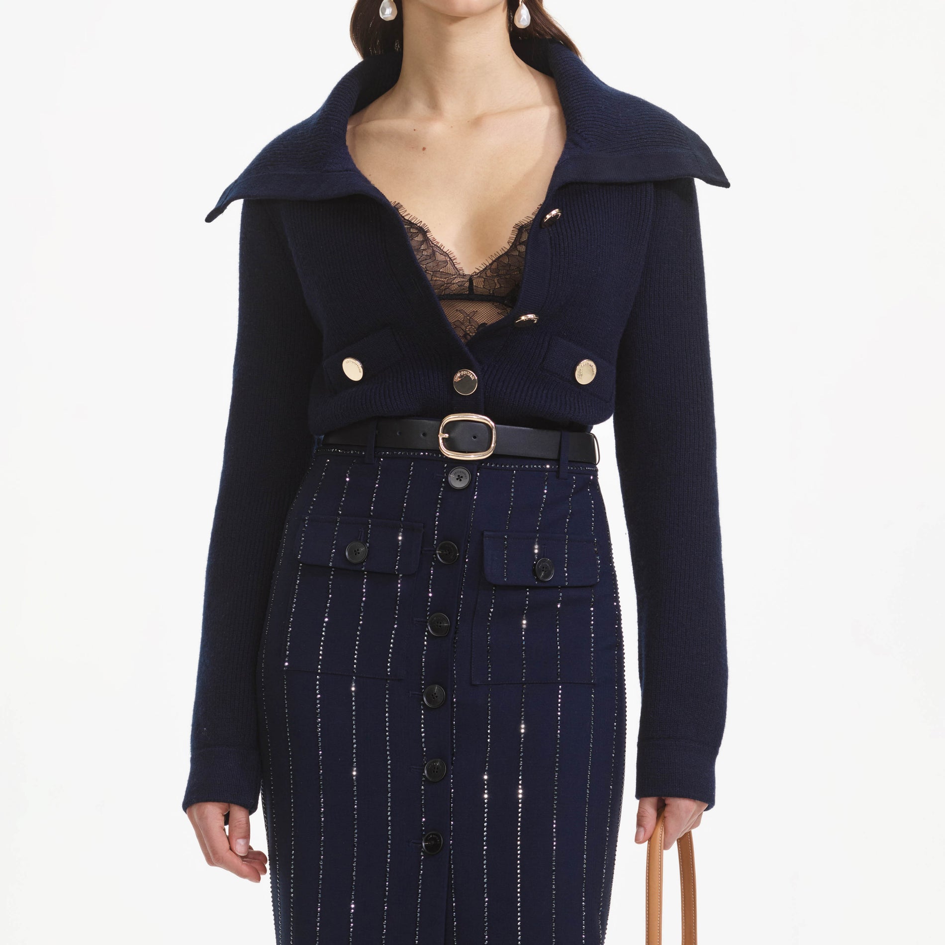 A close up of a woman wearing the Navy Relaxed Fit Cardigan