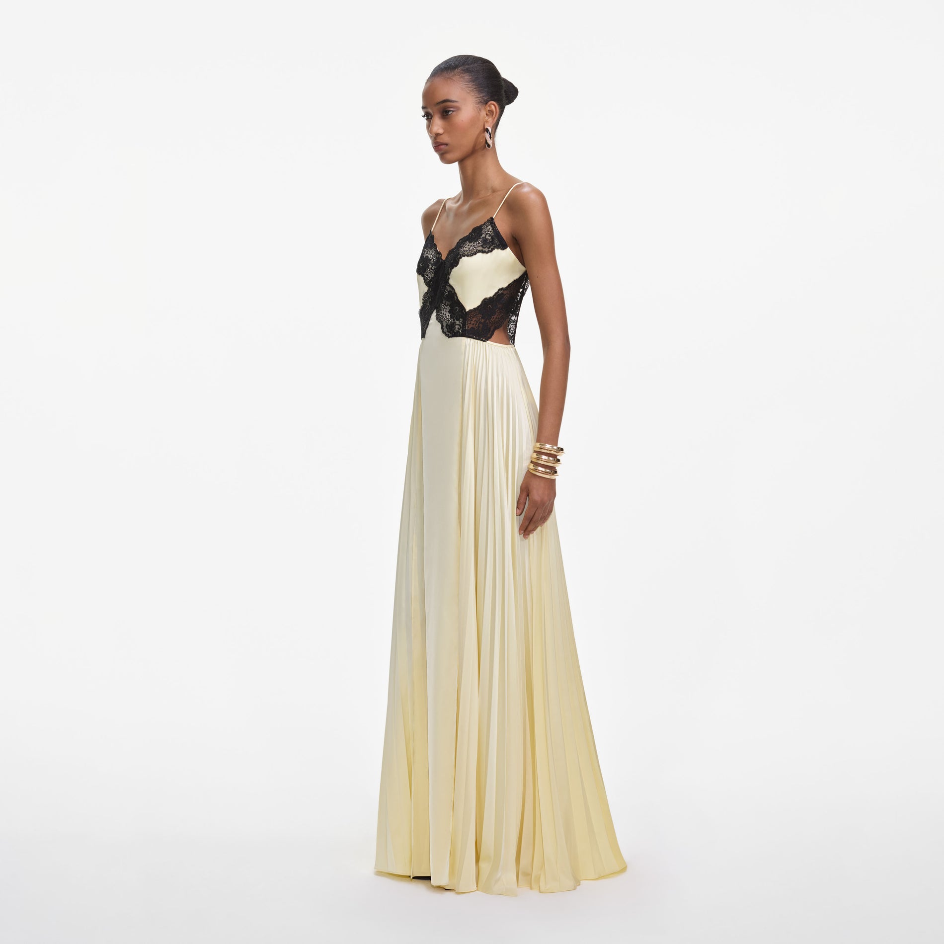 Side view of a woman wearing the Yellow Satin Lace Maxi Dress