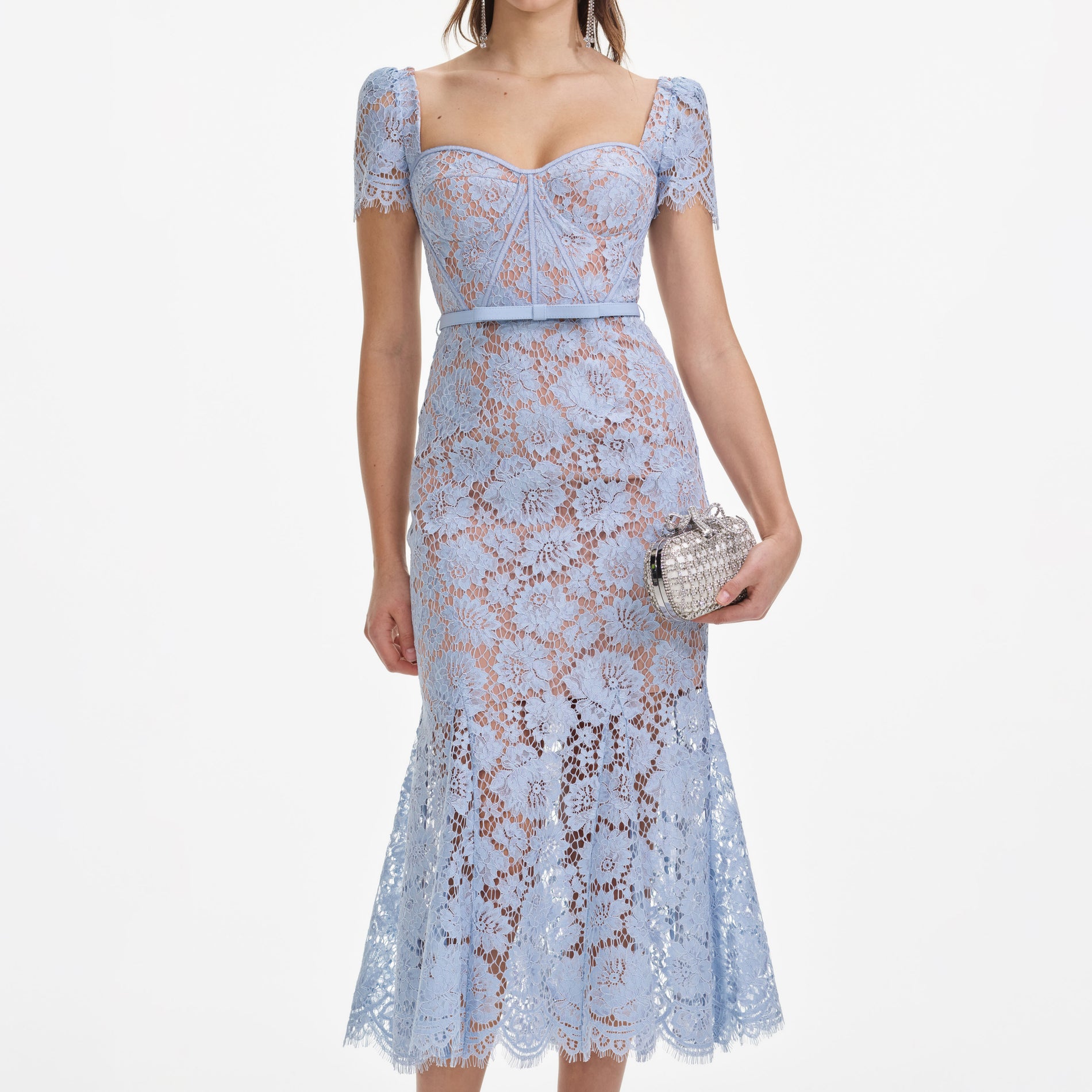 A close up of a woman wearing the Blue Fine Lace Midi Dress