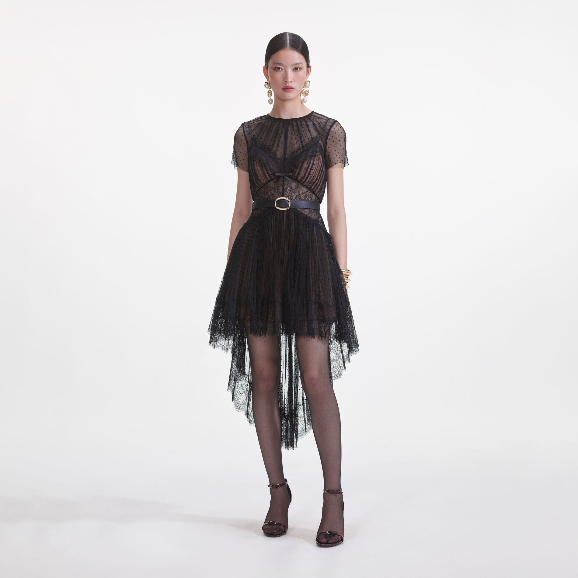 Front view of a woman wearing the Black Dot Mesh Mini Dress